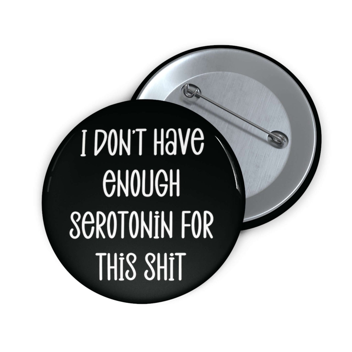Pinback button with the phrase I don't have enough serotonin for this shit printed on it.
