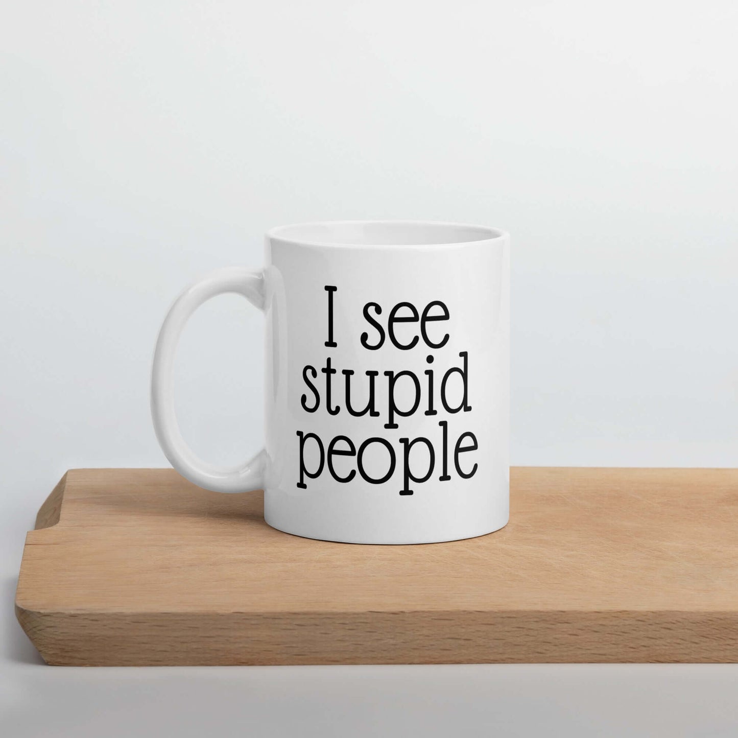 White ceramic mug with the words I see stupid people printed on both sides.