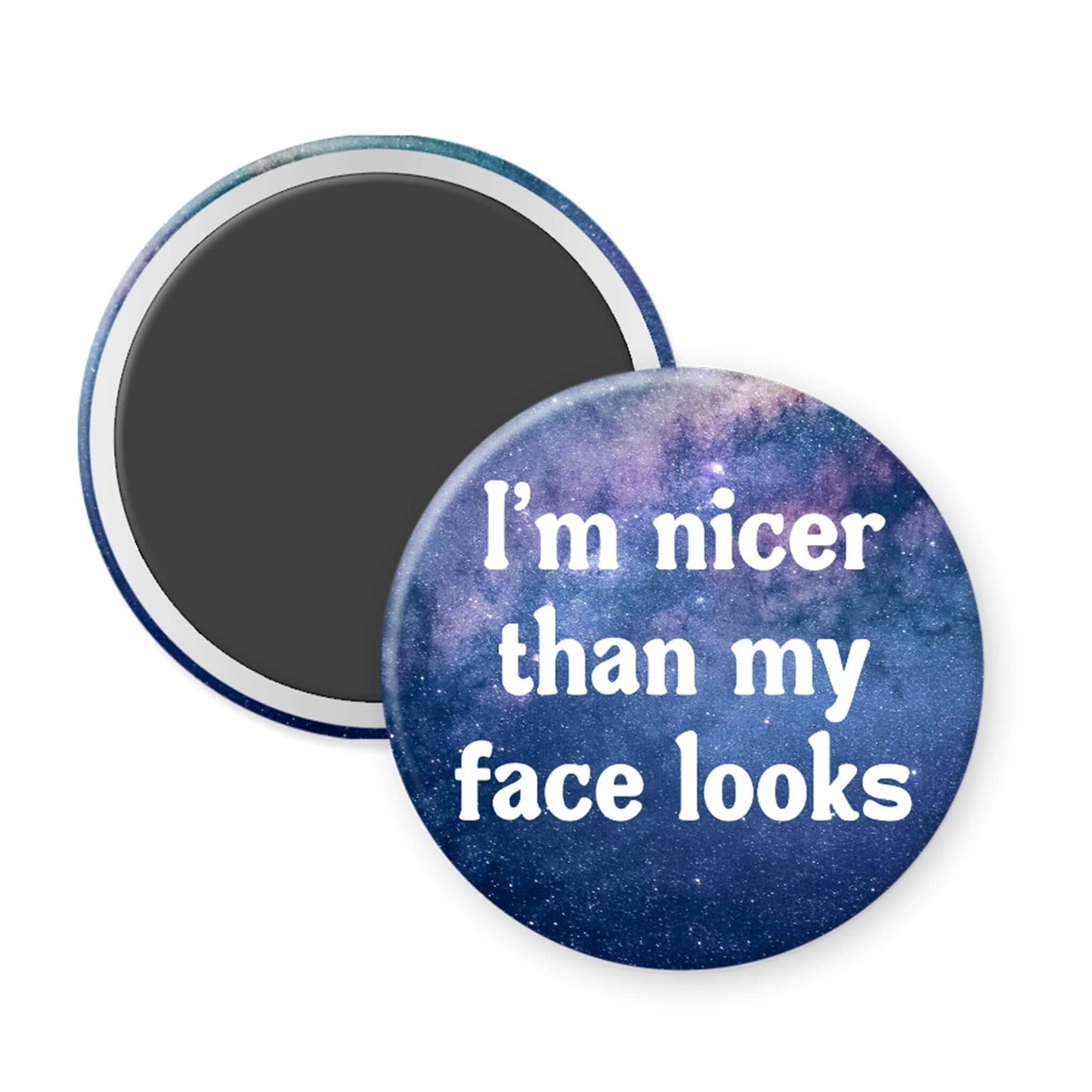 Round magnet with space-themed background and text 'I'm nicer than my face looks' on a white background