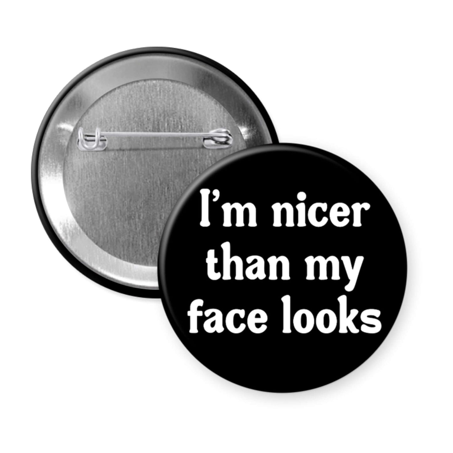 Button badge with text 'I'm nicer than my face looks' on a white background