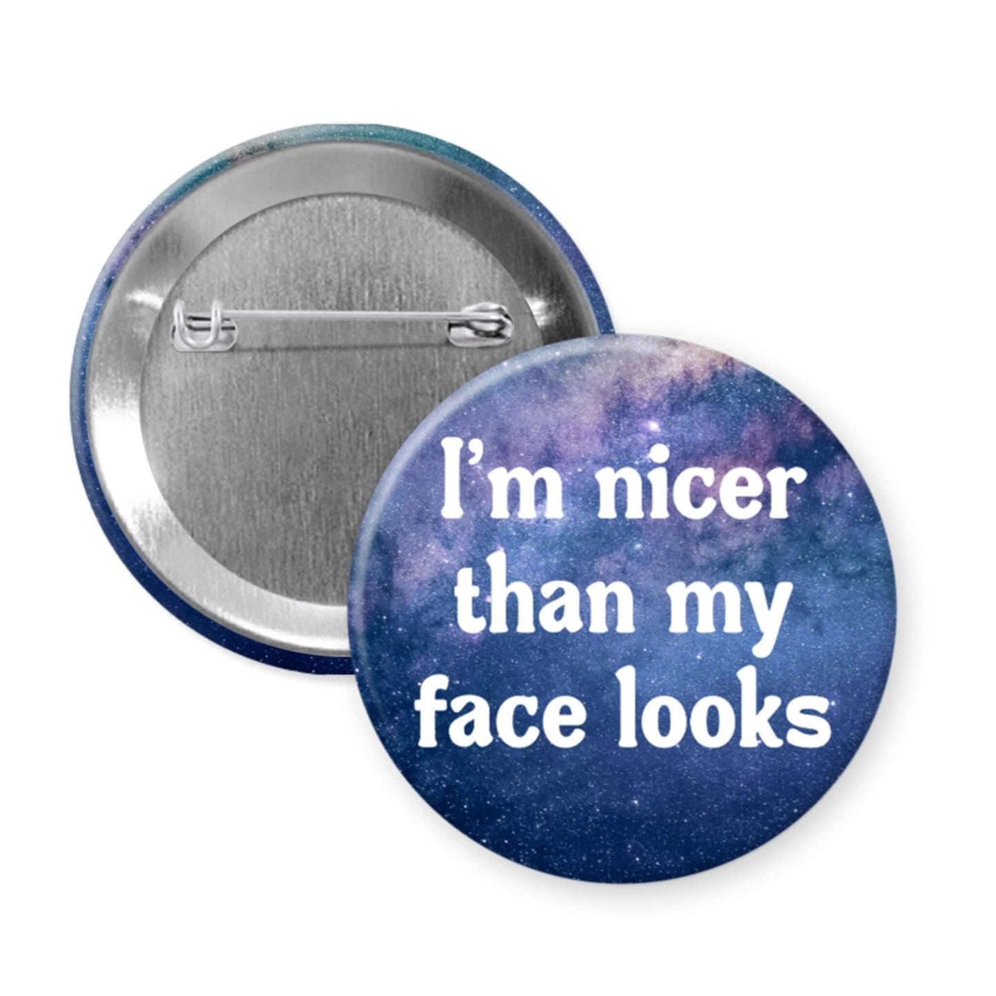 Button badge with 'I'm nicer than my face looks' text on a galaxy-themed background
