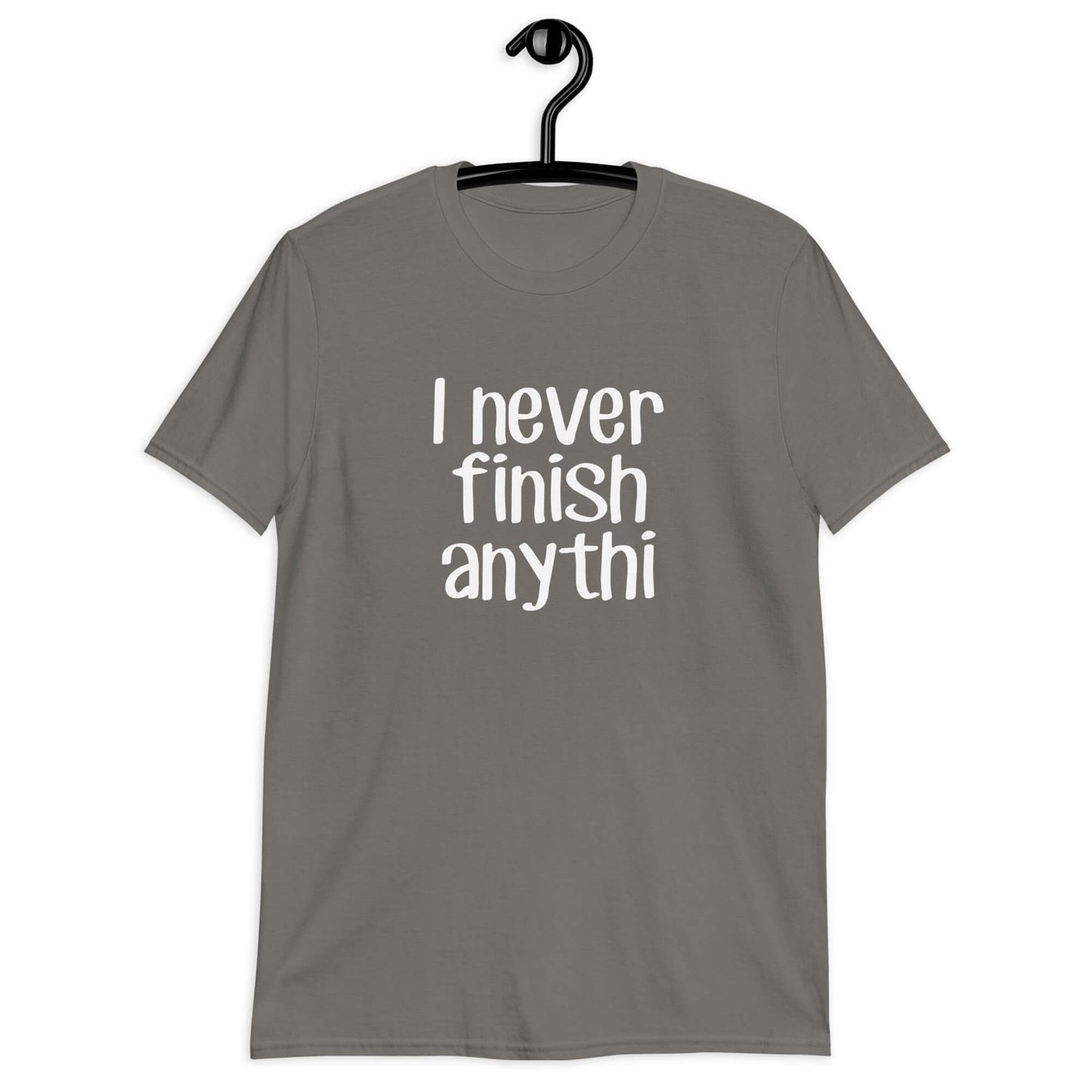 Charcoal grey t-shirt with the phrase I never finish anything printed on the front The letters n and g are missing from the word anything.