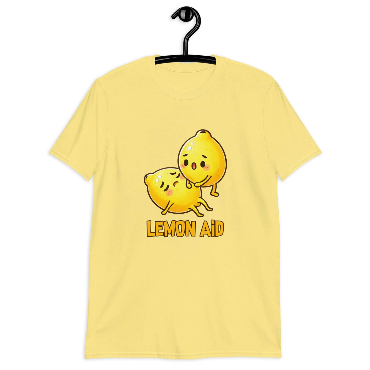 Cornsilk yellow t-shirt with image of 2 cartoon lemons. One lemon is giving the other lemon CPR. The words Lemon Aid is under the lemons. The graphic is printed on the front.