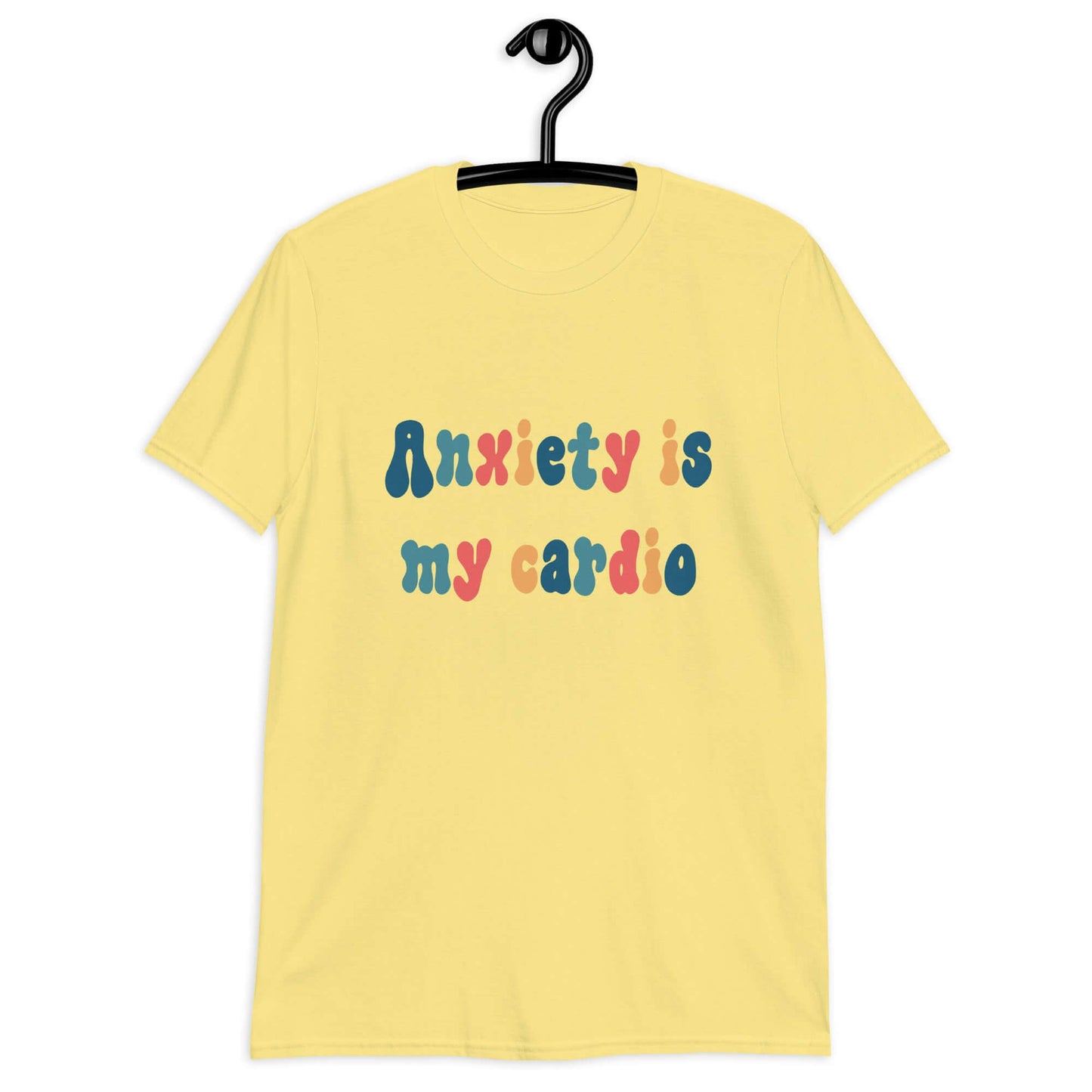 Cornsilk yellow t-shirt with the phrase Anxiety is my cardio printed in multiple colors on the front of the shirt.