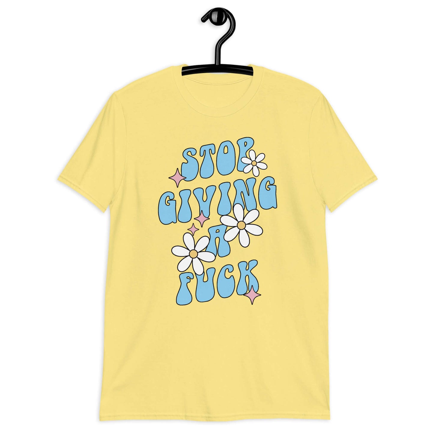 Cornsilk yellow t-shirt with a retro daisy and star design and the phrase Stop giving a fuck printed on the front.