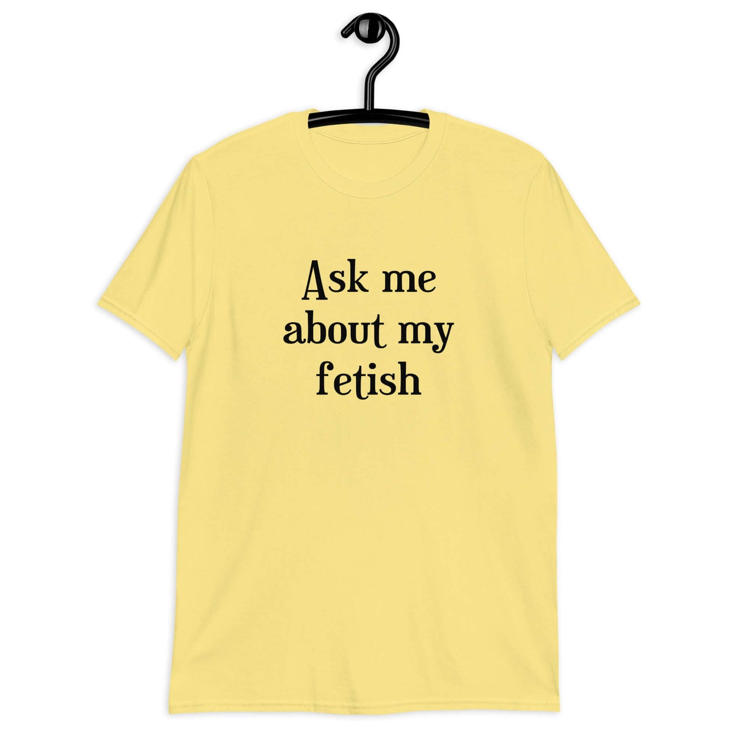 Cornsilk yellow t-shirt with the words Ask me about my fetish printed on the front.