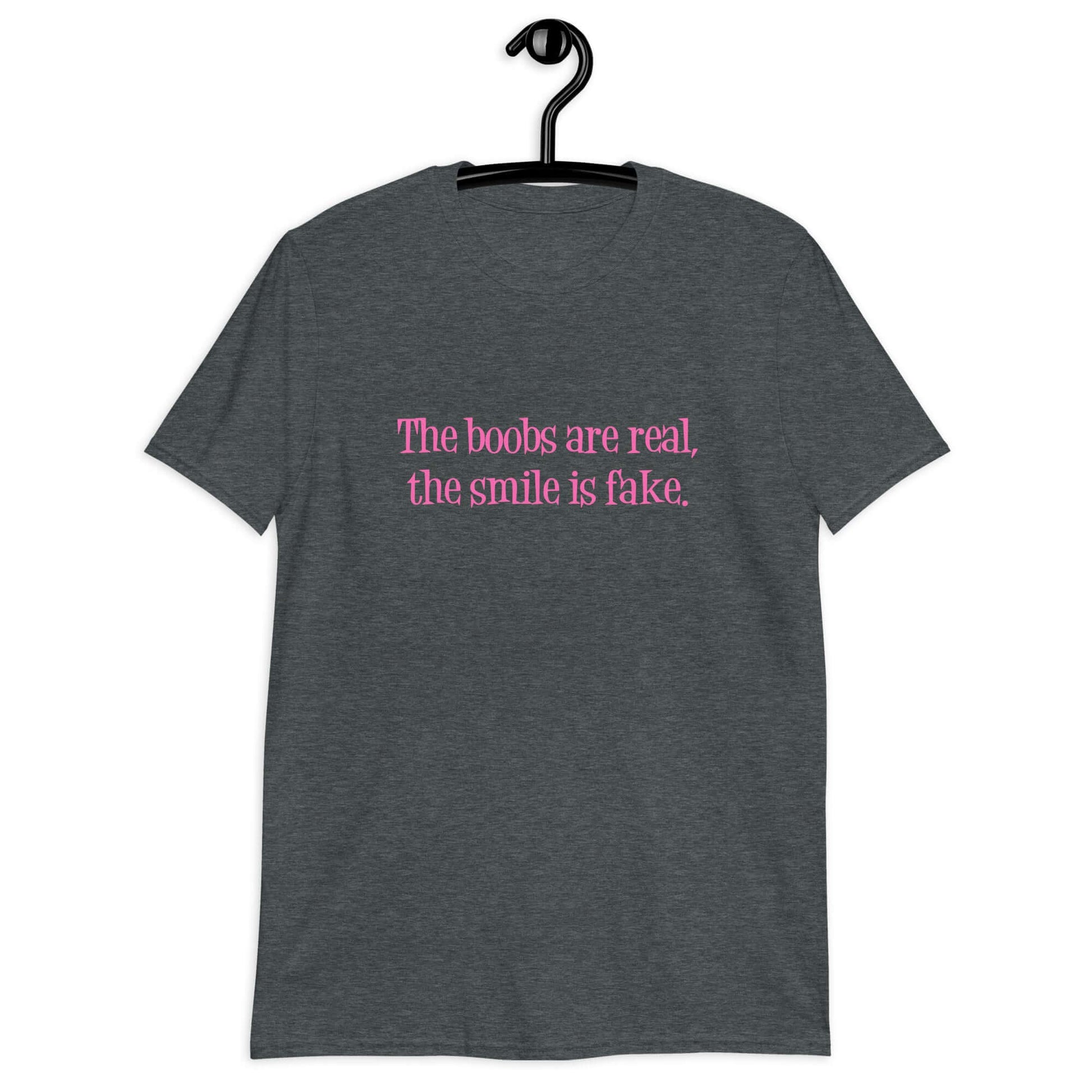 Dark heather grey t-shirt with the phrase The boobs are real, the smile is fake printed in pink on the front.