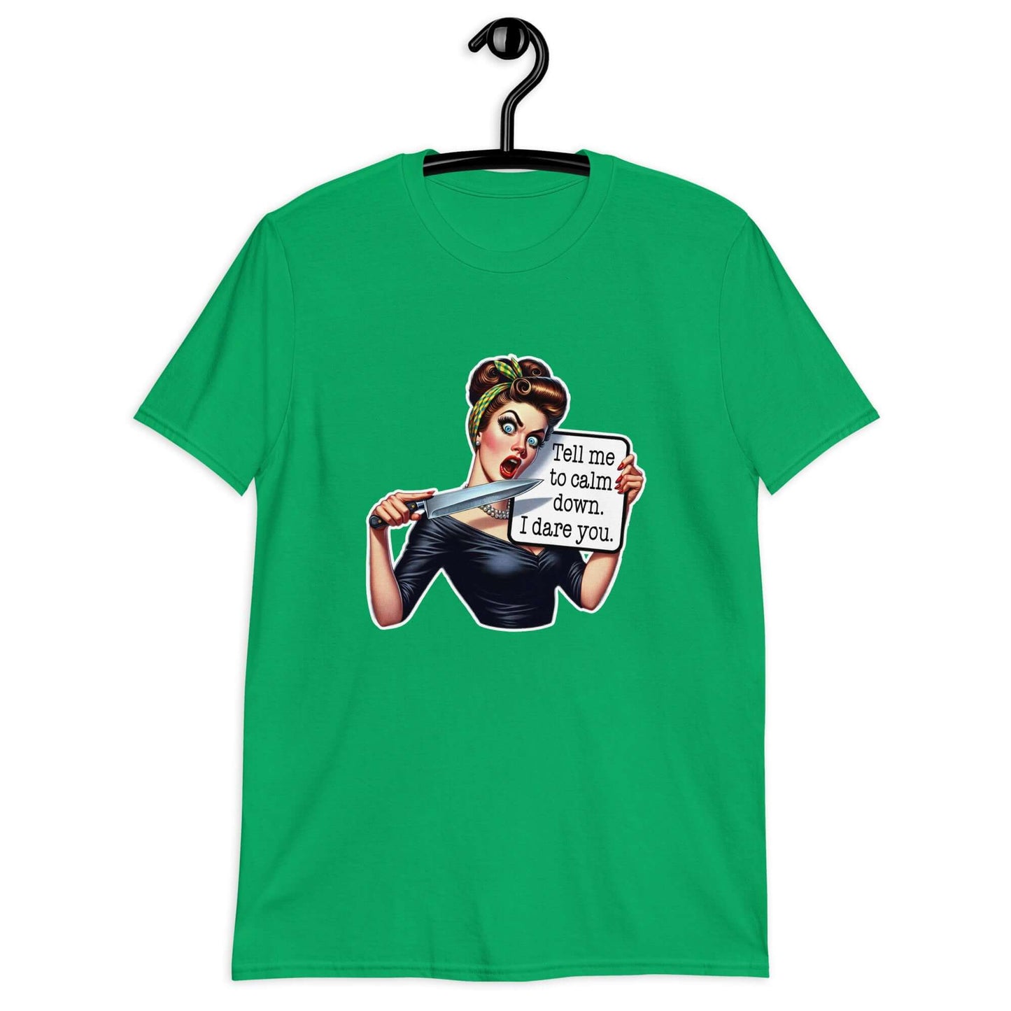 Irish green t-shirt displayed on a hanger. The t-shirt has a graphic of an angry looking retro woman holding a knife and a sign. The sign says Tell me to calm down I dare you. The graphic is printed on the front of the shirt.
