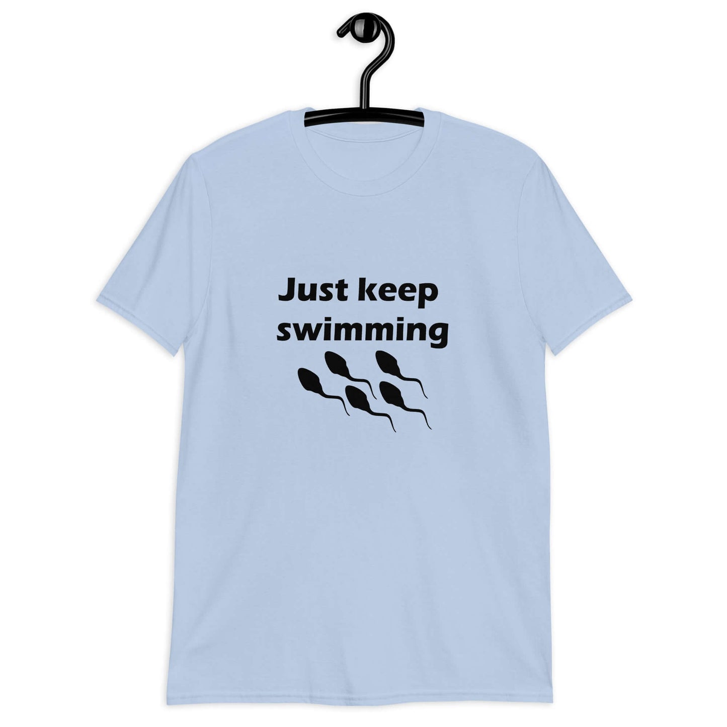 Light blue t-shirt with the phrase Just keep swimming printed on the front. There is an image of some swimming sperm underneath the words.