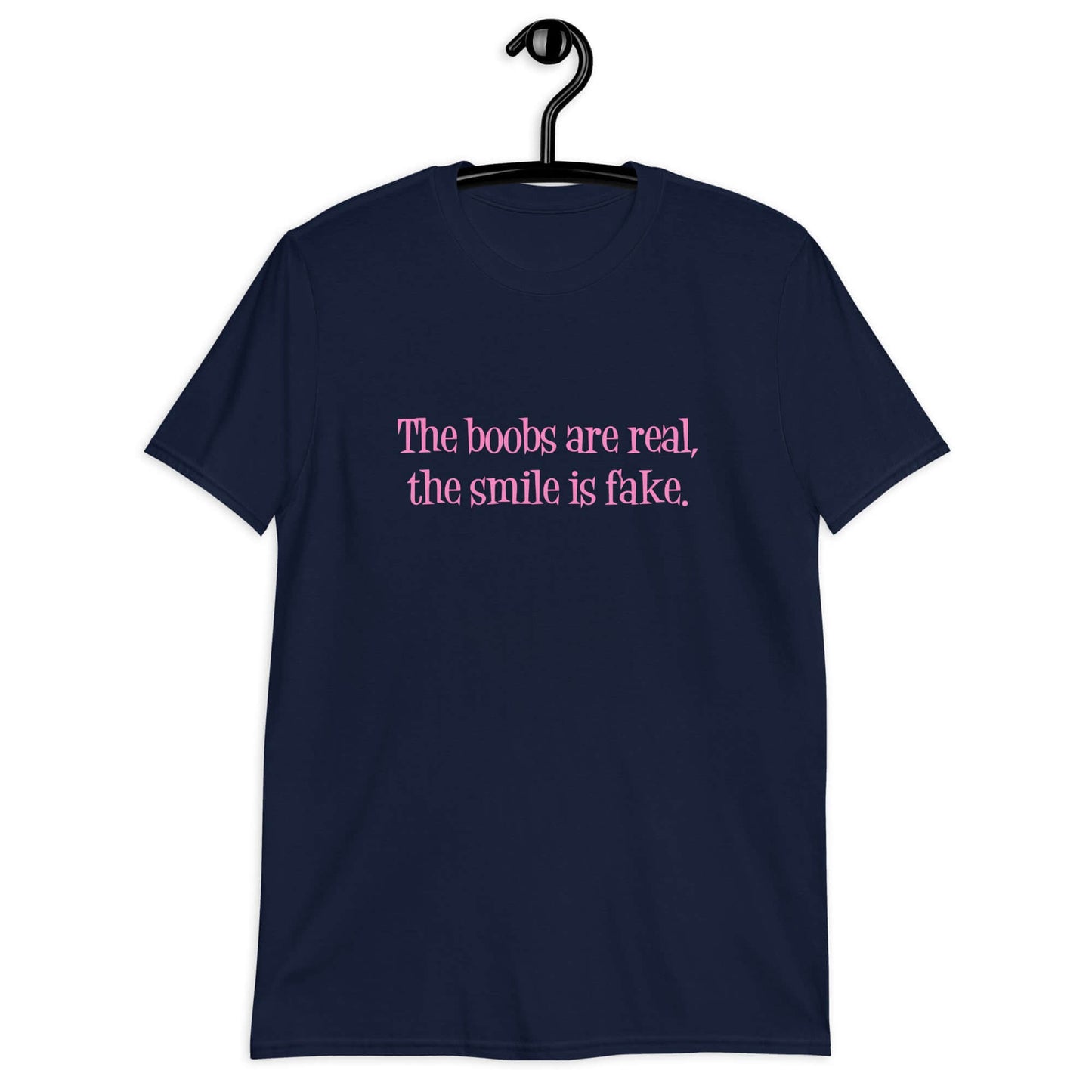 Navy blue t-shirt with the phrase The boobs are real, the smile is fake printed in pink on the front.