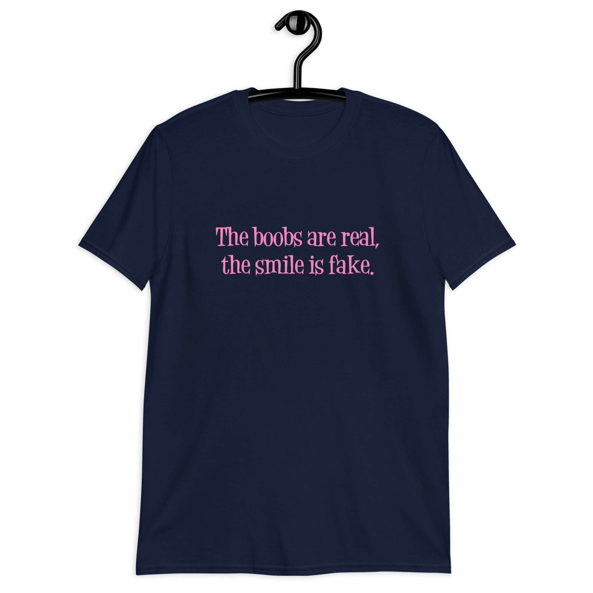 Navy blue t-shirt with the phrase The boobs are real, the smile is fake printed in pink on the front.