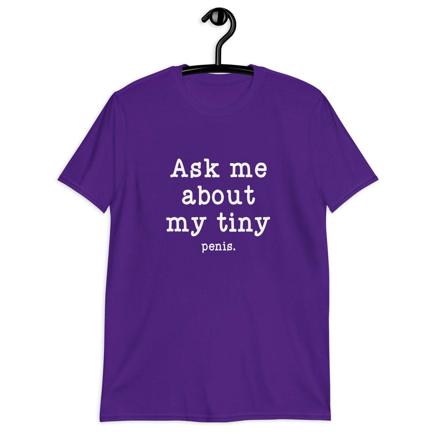 Purple t-shirt with the phrase Ask me about my tiny penis printed on the front. The word penis is much smaller than the rest of the text.