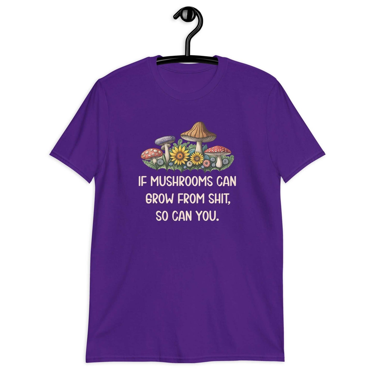 Purple t-shirt with images of mushrooms and the phrase If mushrooms can grow from shit so can you printed on the front.