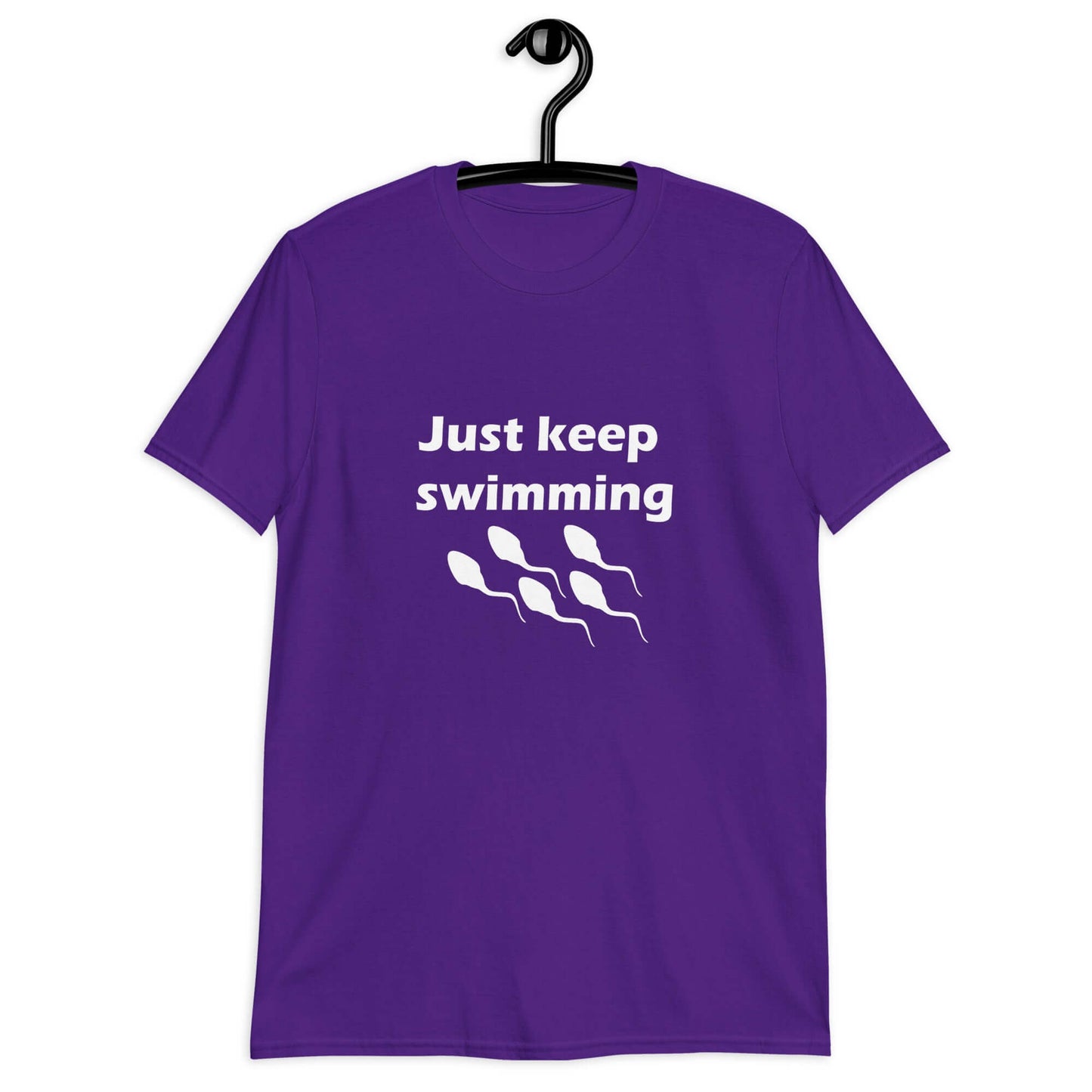 Purple t-shirt with the phrase Just keep swimming printed on the front. There is an image of some swimming sperm underneath the words.