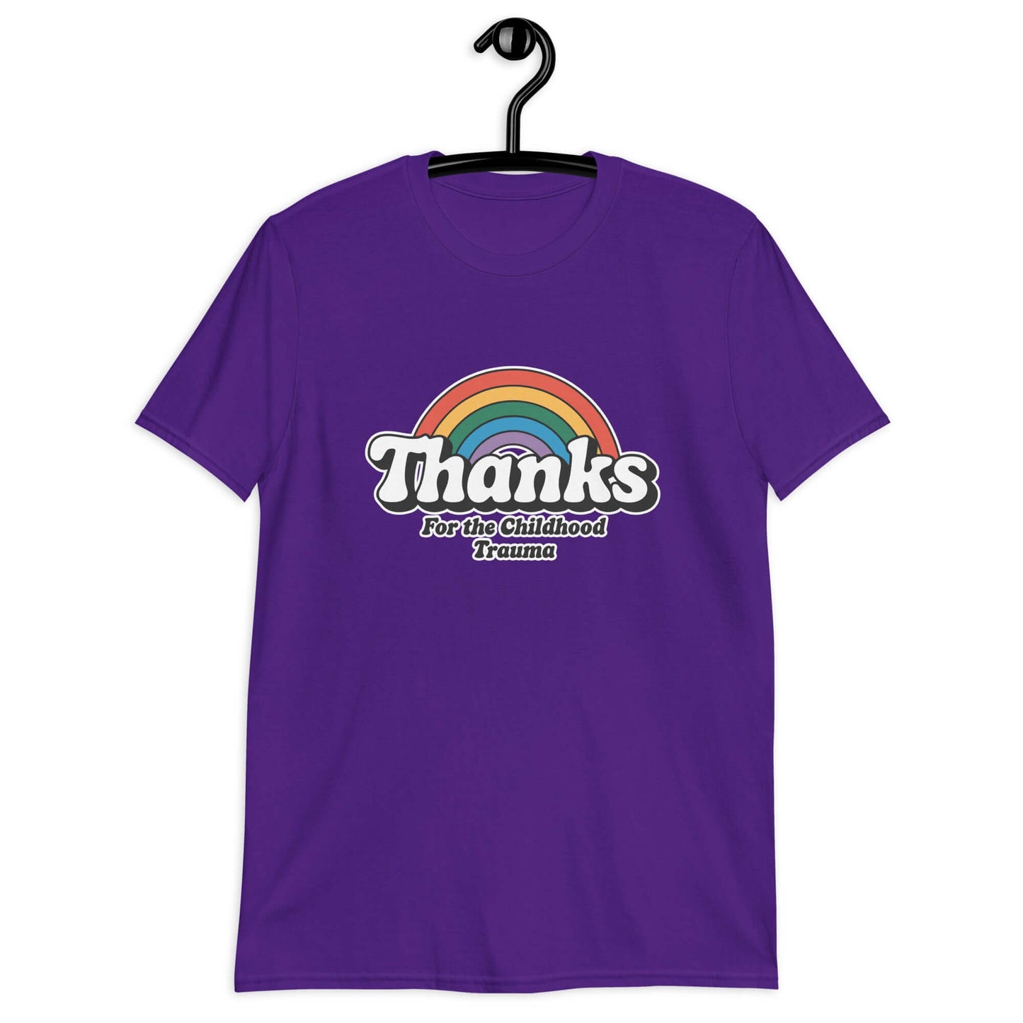 Purple t-shirt with an image of a rainbow and the words Thanks for the childhood trauma printed on the front. The word Thanks is large and the rest of the words are smaller under.