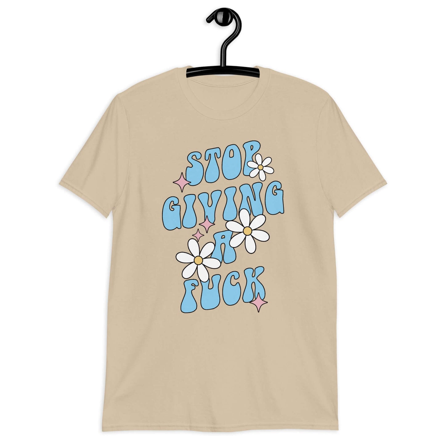 Sand t-shirt with a retro daisy and star design and the phrase Stop giving a fuck printed on the front.