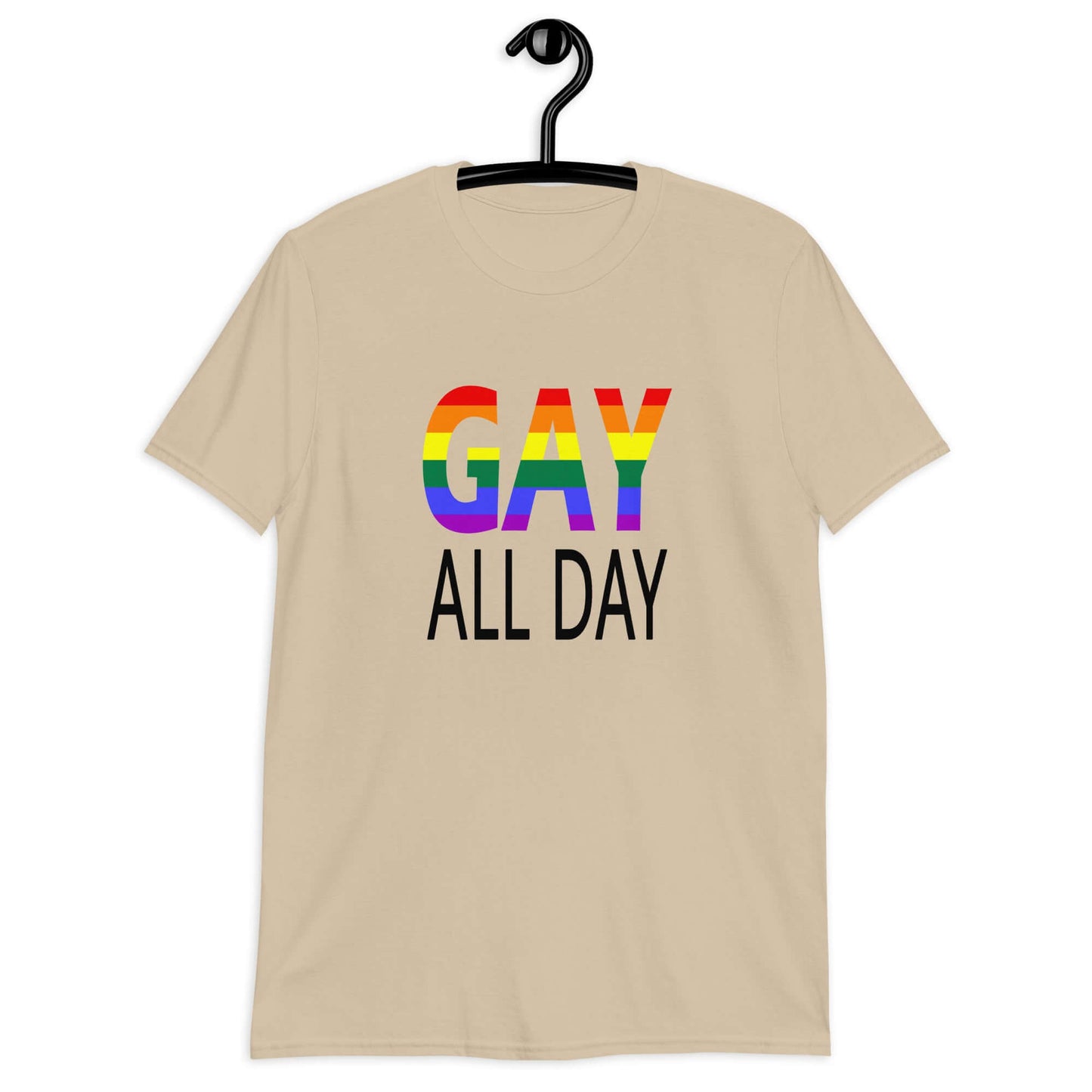 Sand color t-shirt with the words Gay all day printed on the front. The word Gay is in rainbow stripe font.