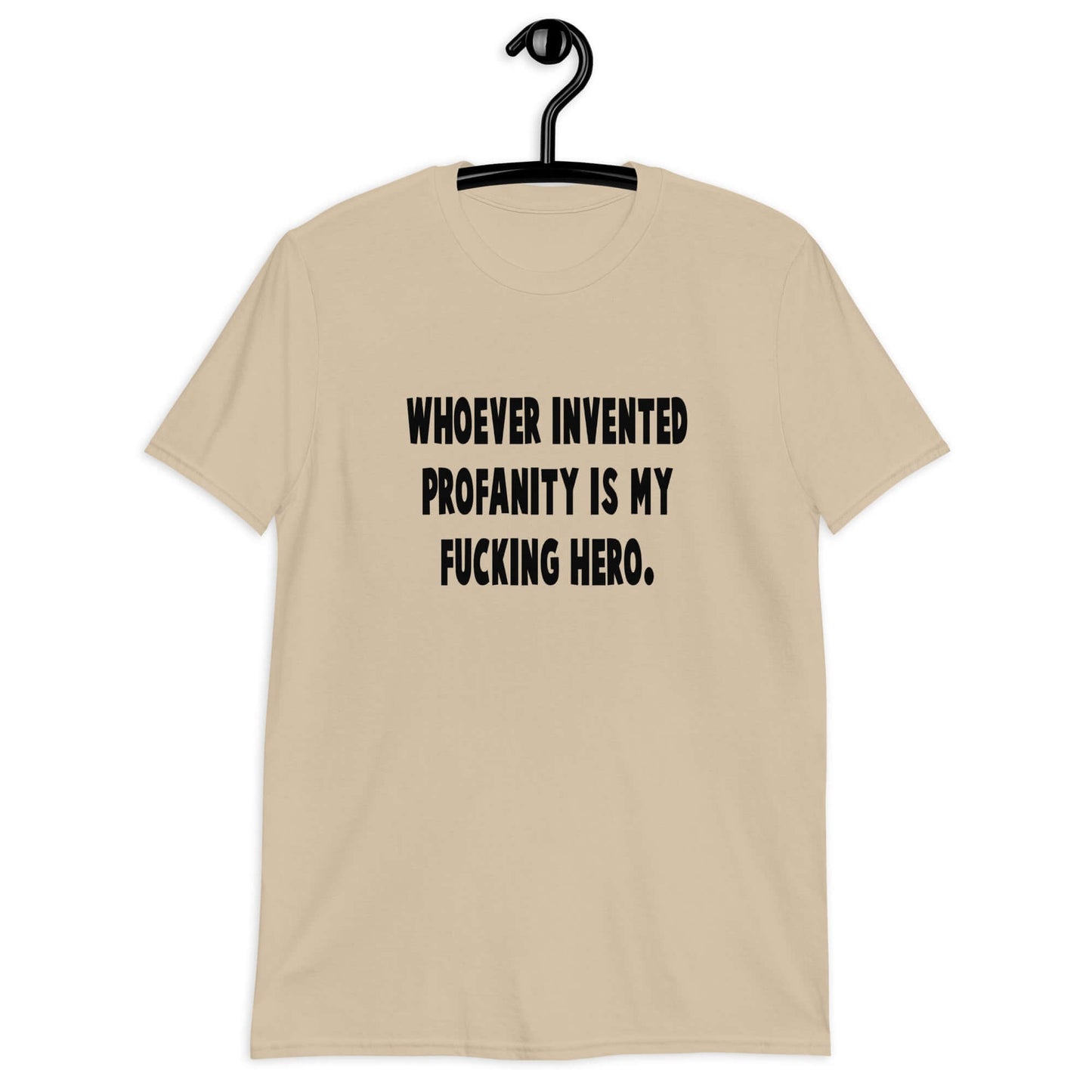 Sand t-shirt with the phrase Whoever invented profanity is my fucking hero printed on the front.