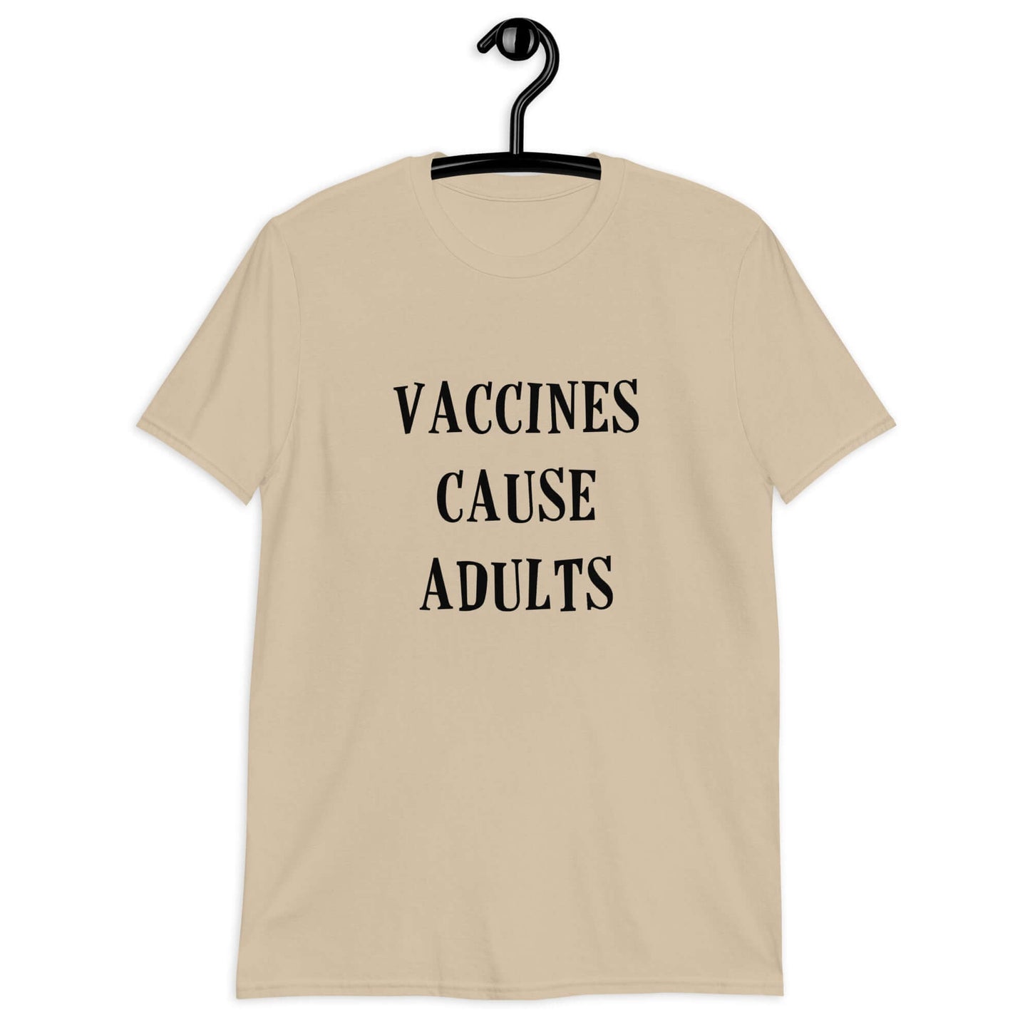 Sand color t-shirt with the phrase Vaccines cause adults printed on the front.