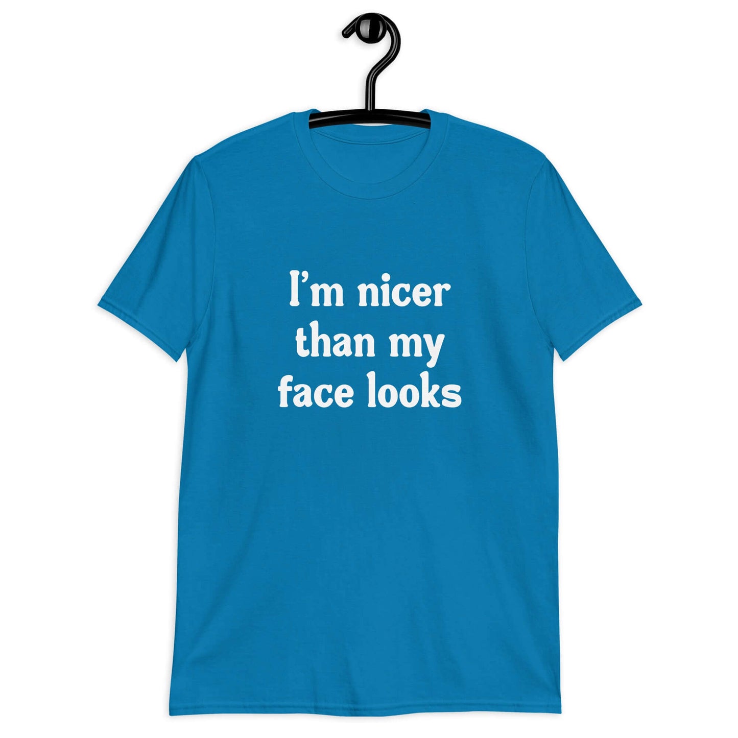 Sapphire blue t-shirt with the phrase I'm nicer than my face looks printed on the front.