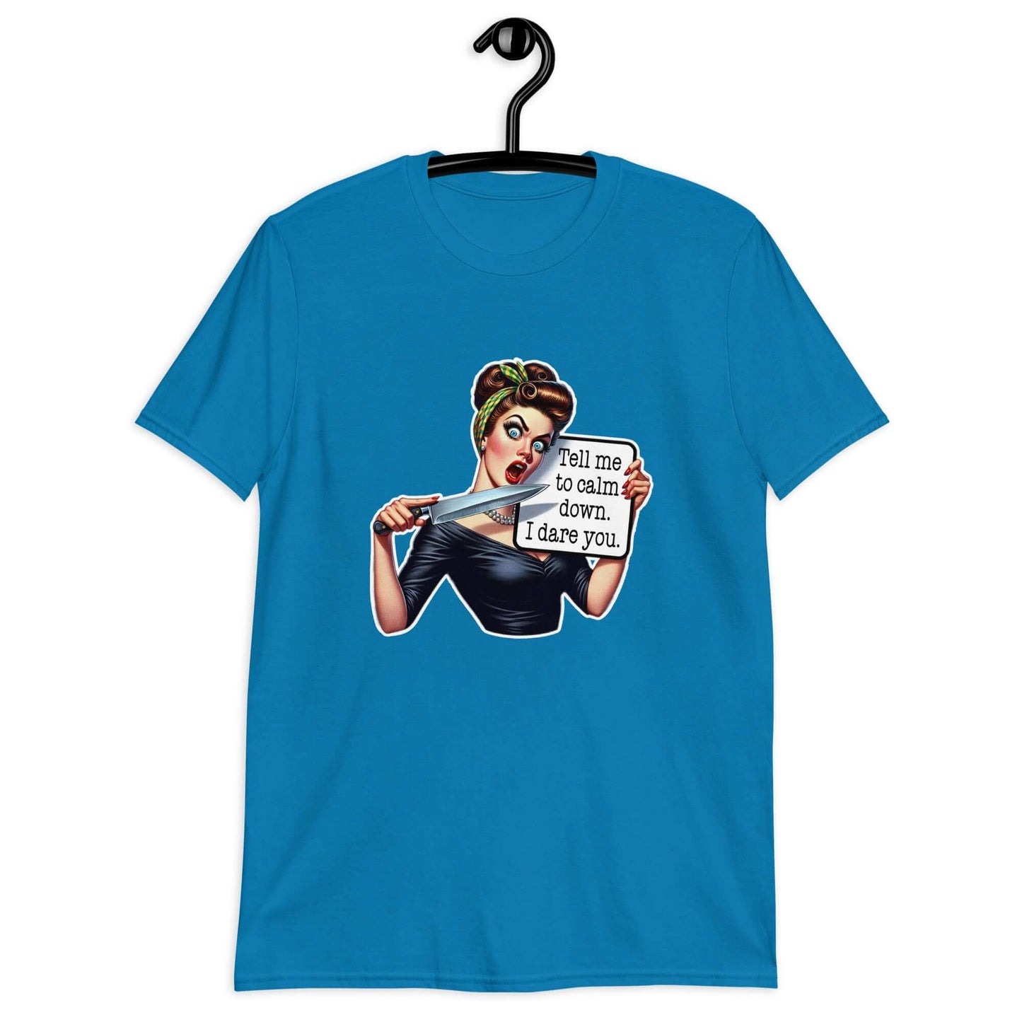 Sapphire blue t-shirt displayed on a hanger. The t-shirt has a graphic of an angry looking retro woman holding a knife and a sign. The sign says Tell me to calm down I dare you. The graphic is printed on the front of the shirt.