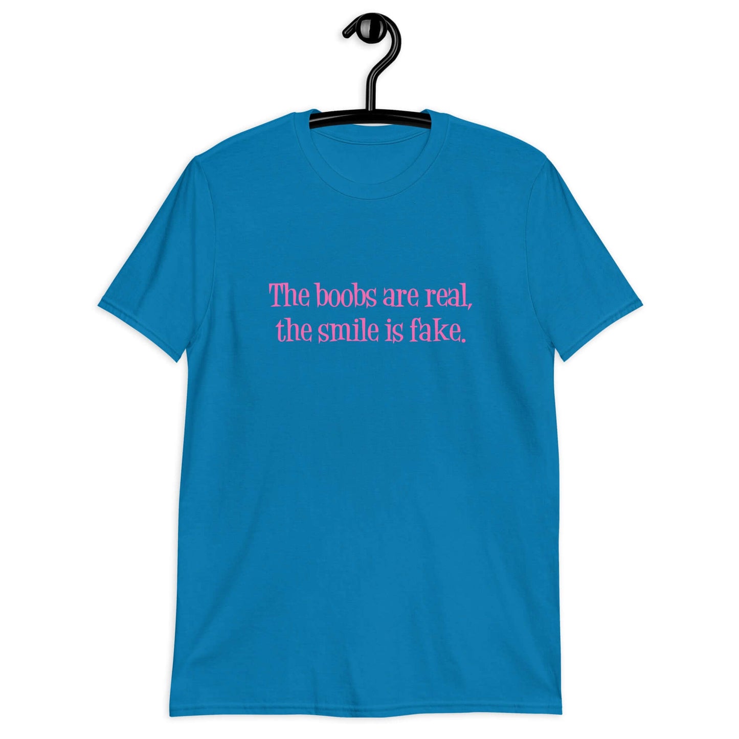 Sapphire blue t-shirt with the phrase The boobs are real, the smile is fake printed in pink on the front.