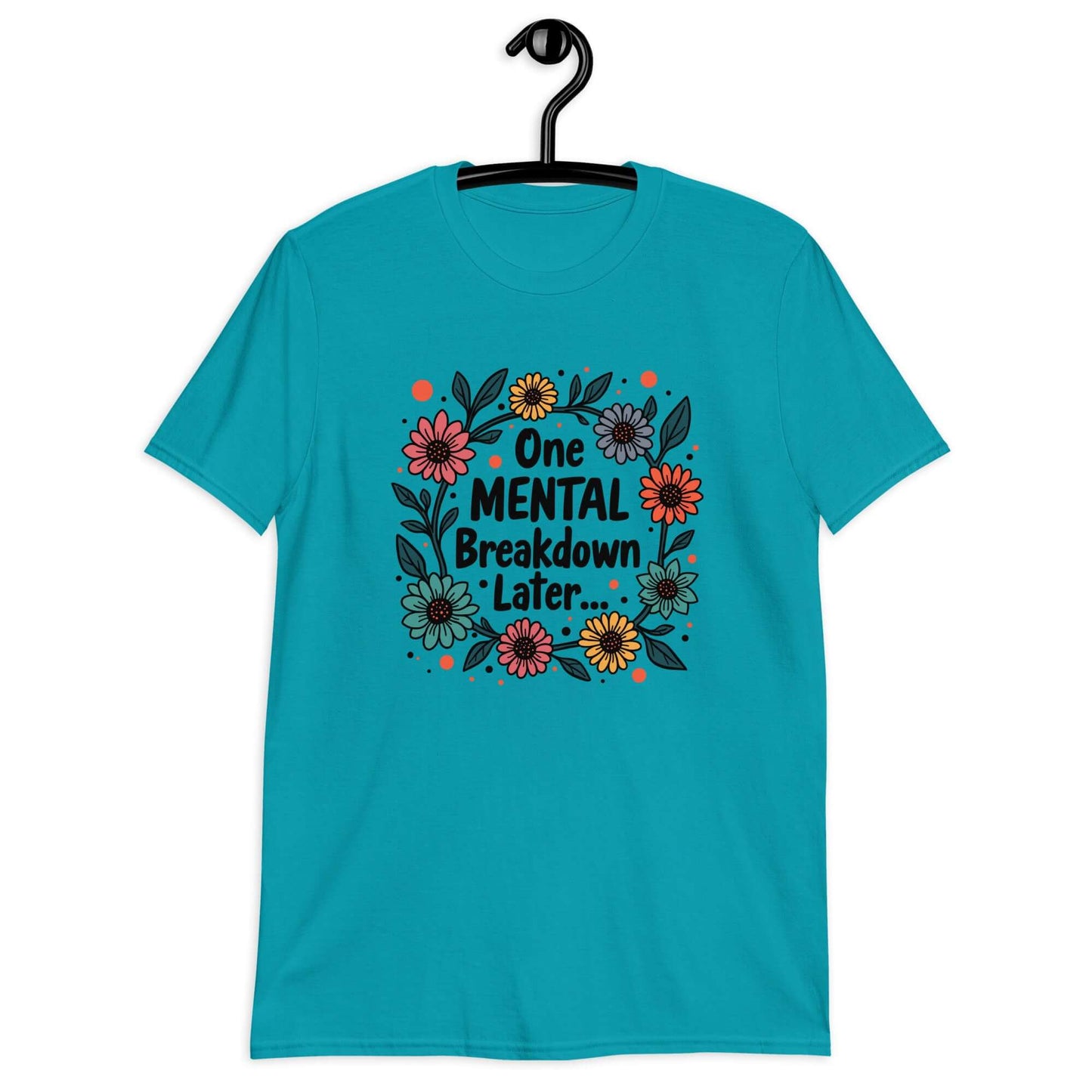 Tropical blue t-shirt with a multi color floral wreath design printed on the front. The words One mental breakdown later are printed in the center of the wreath.