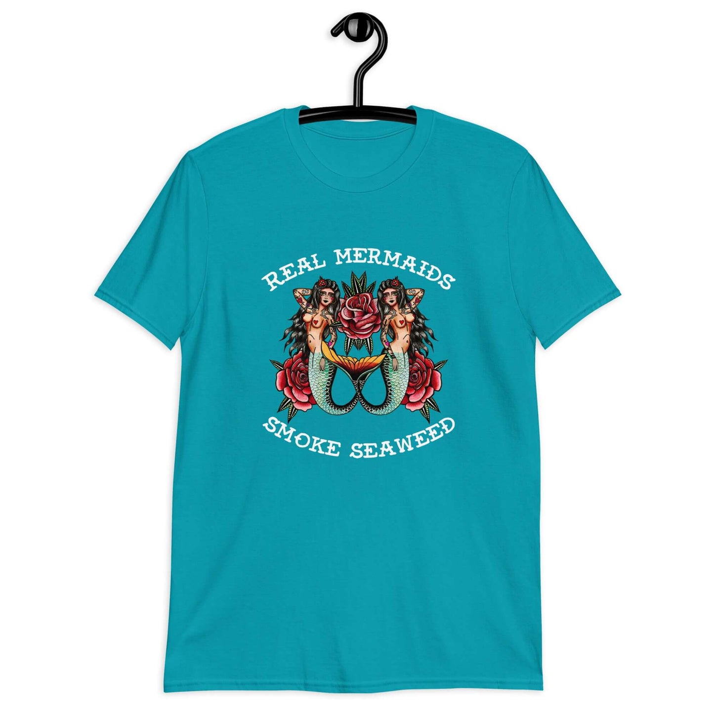 Tropical blue t-shirt with image of 2 mermaids and the words Real mermaids smoke seaweed printed on the front.