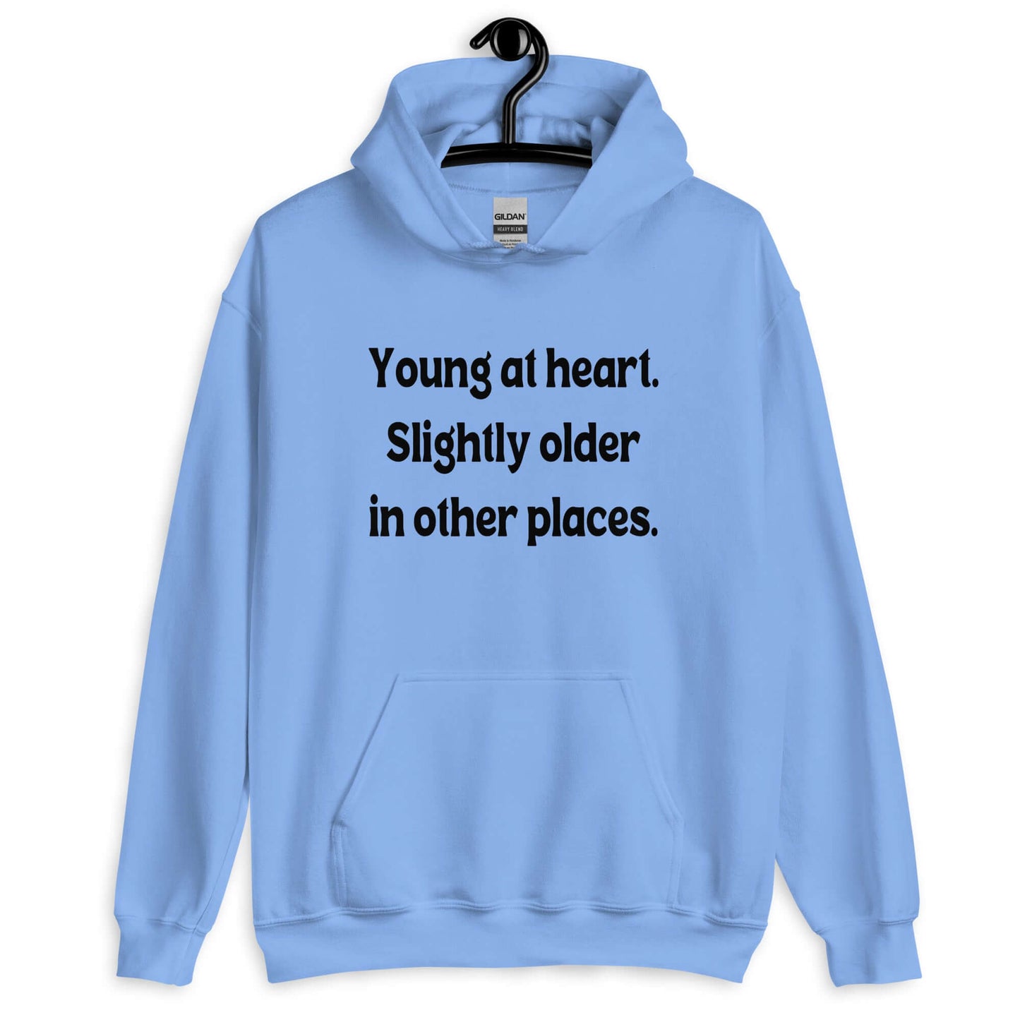 Carolina blue hoodie sweatshirt with the words Young at heart, slightly older in other places printed on the front.