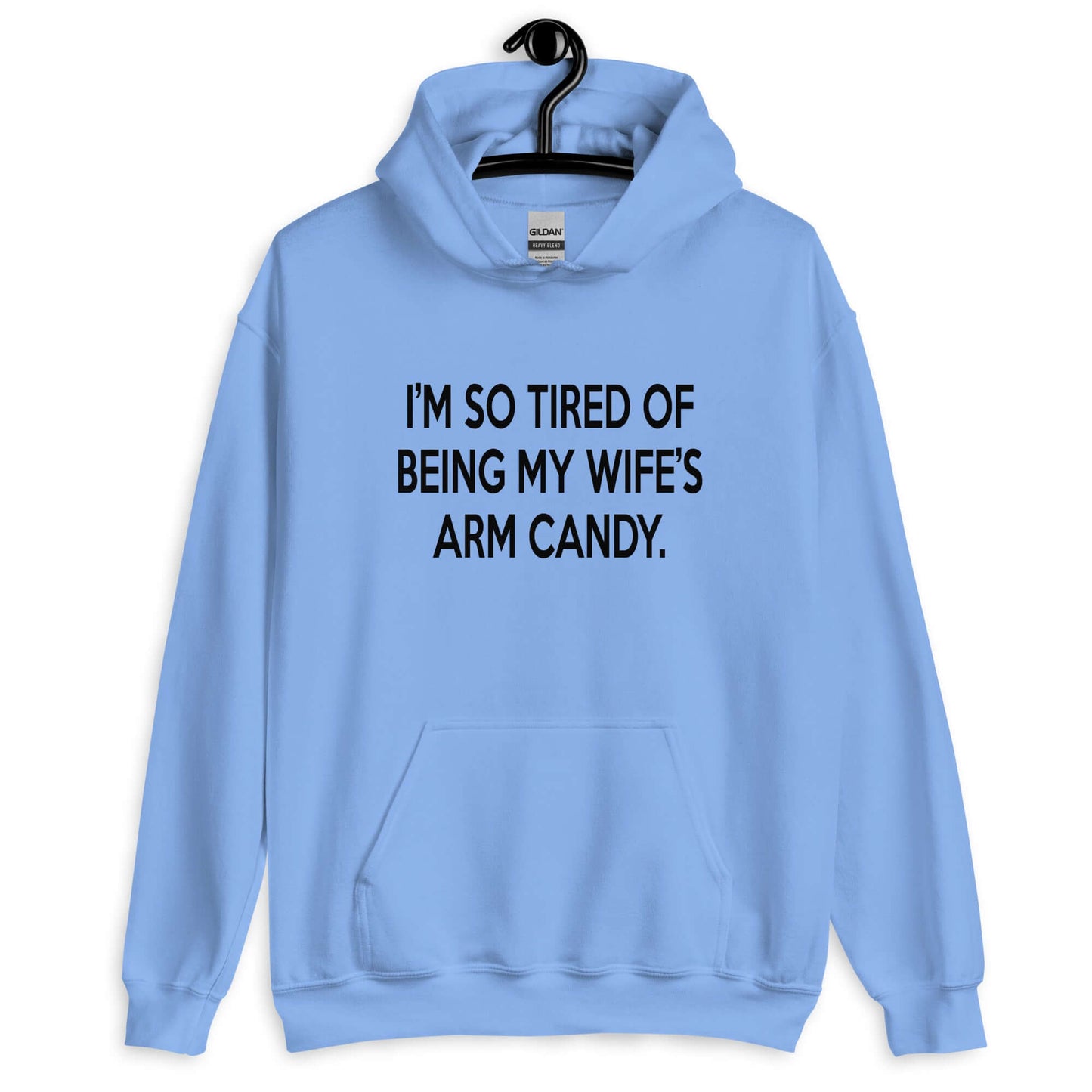 Carolina blue hoodie sweatshirt with the funny phrase I'm so tired of being my wife's arm candy printed on the front.