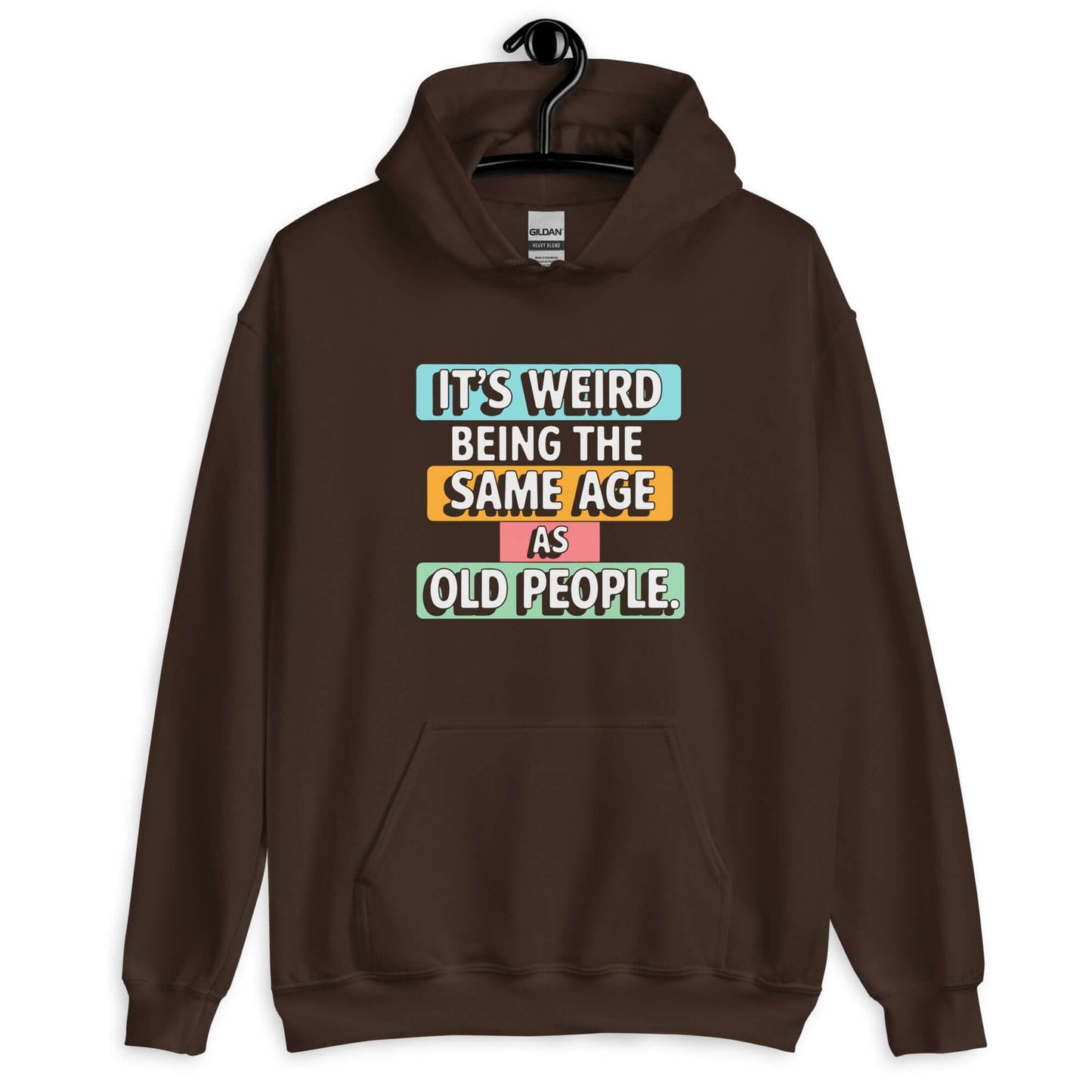 Dark brown hoodie sweatshirt with colorful graphics that say It's weird being the same age as old people printed on the front.