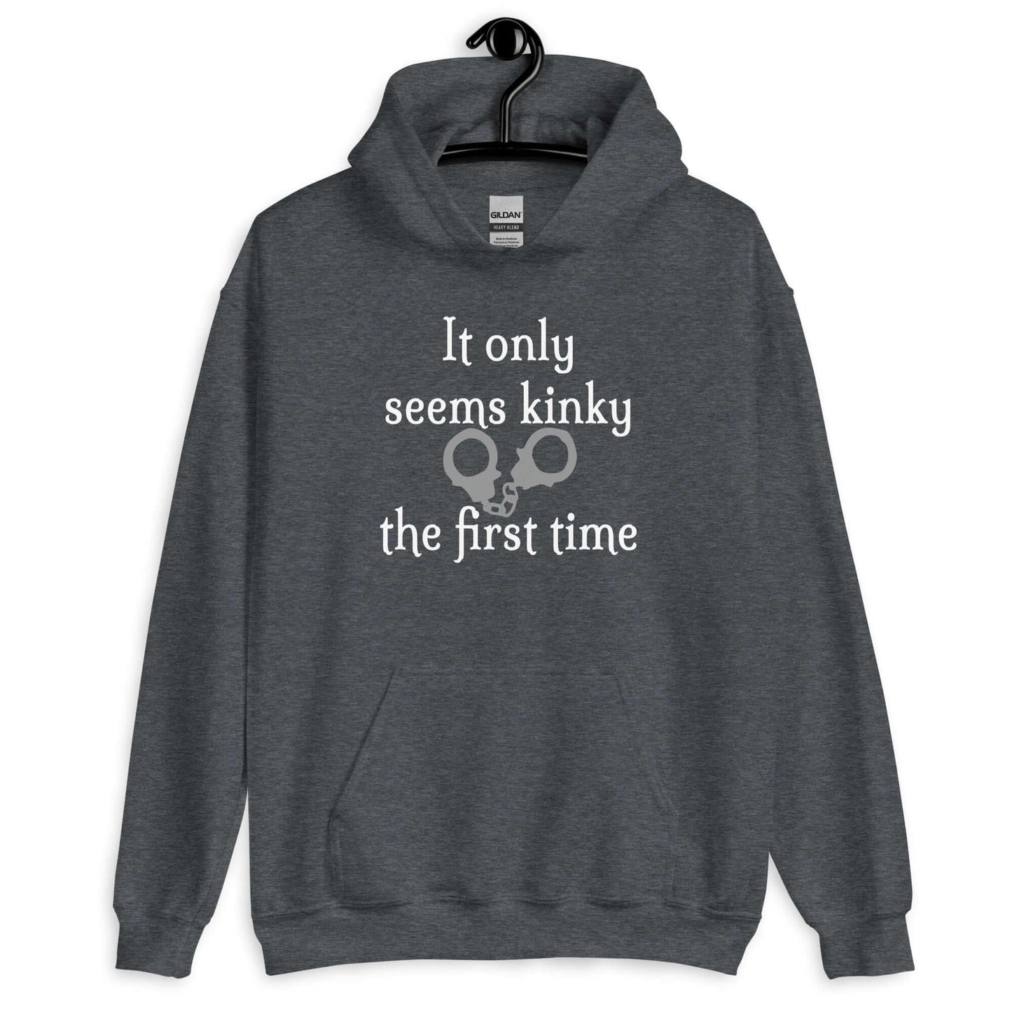 Dark heather grey hoodie sweatshirt with the phrase It only seems kinky the first time printed on the front. There is an image of handcuffs with the text.