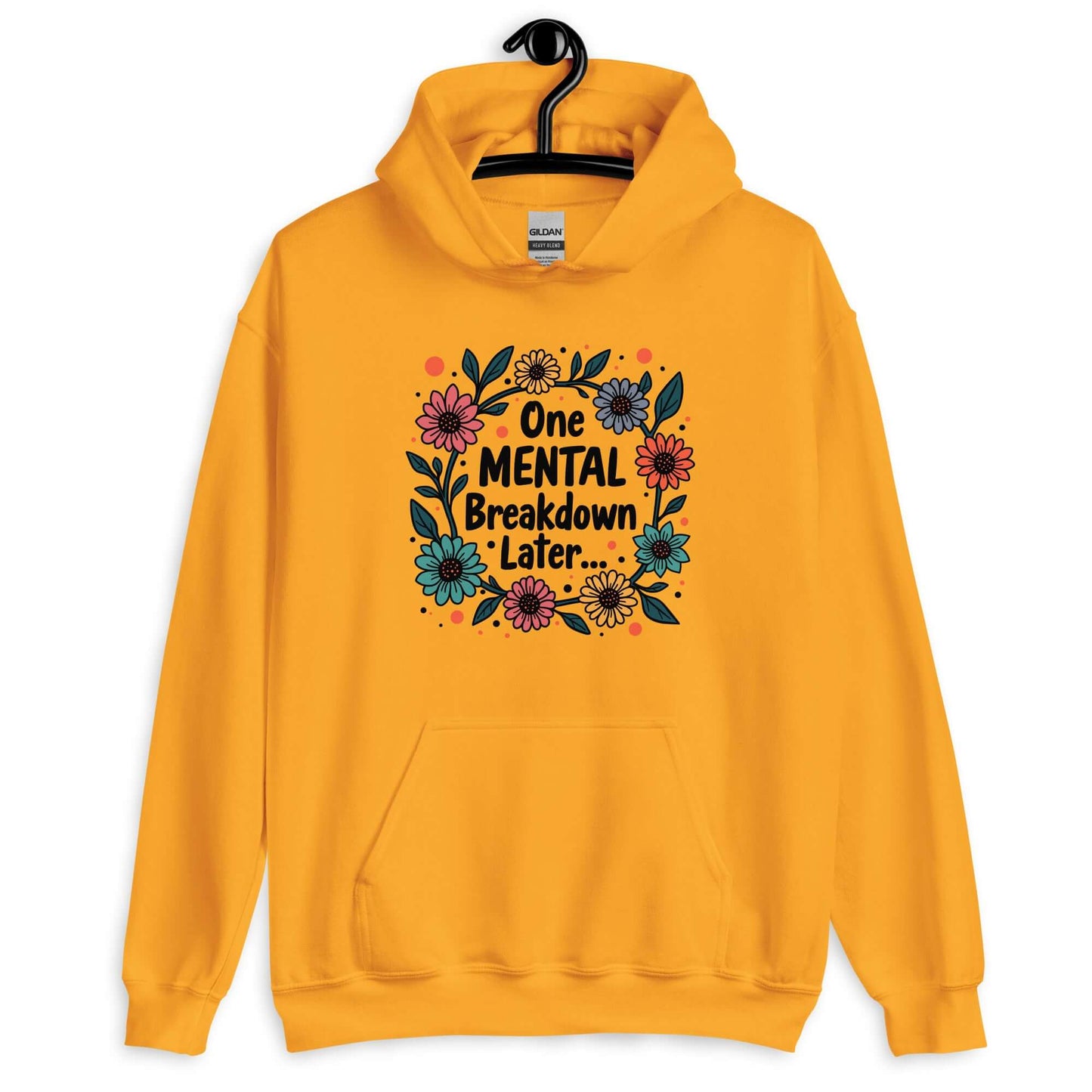 Gold yellow hoodie sweatshirt with a multi color floral wreath design printed on the front. The words One mental breakdown later are printed in the center of the wreath.