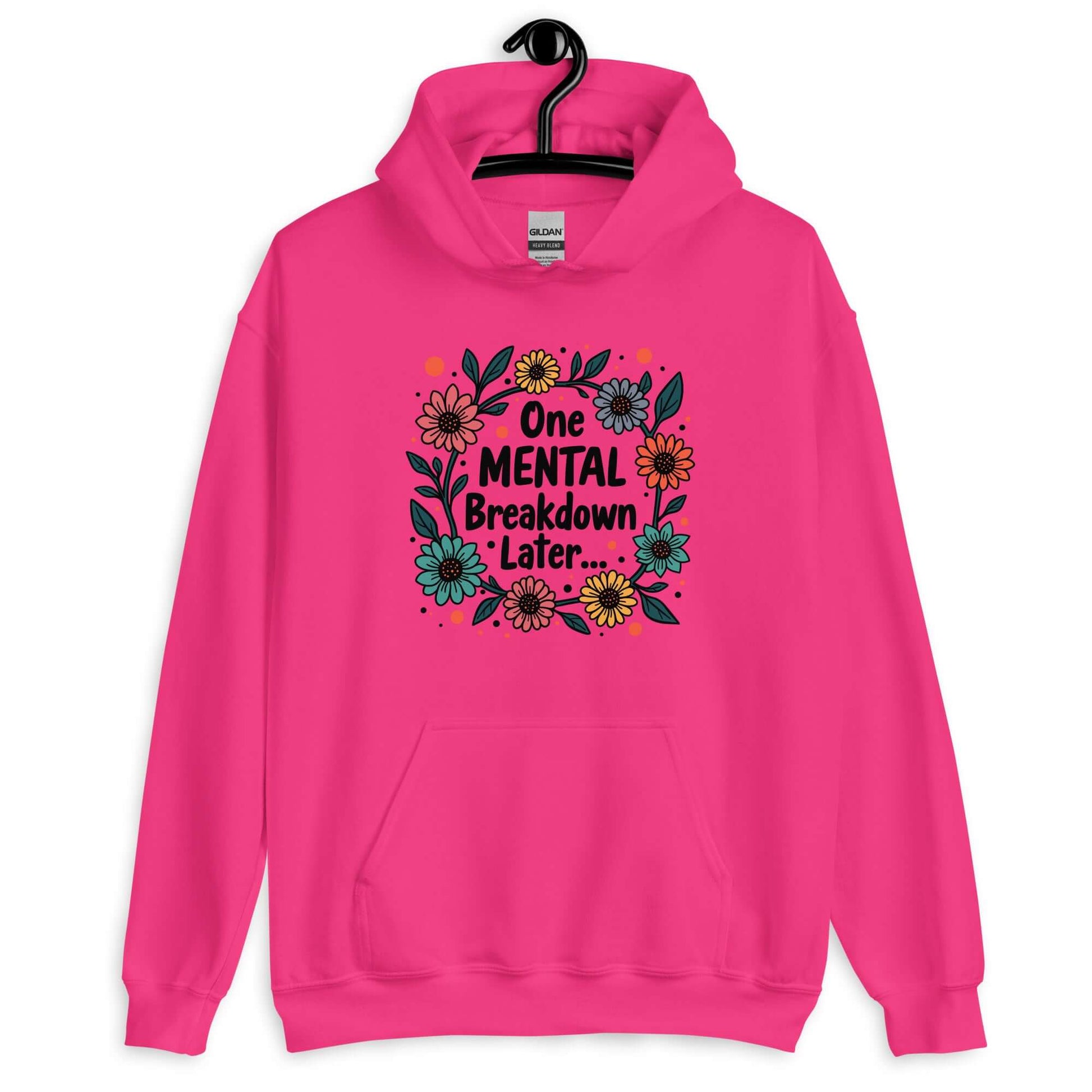 Heliconia pink hoodie sweatshirt with a multi color floral wreath design printed on the front. The words One mental breakdown later are printed in the center of the wreath.
