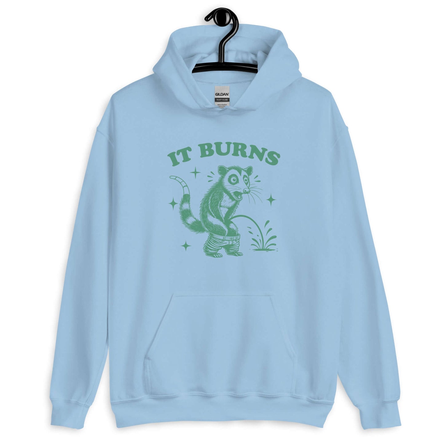 Light blue hoodie sweatshirt with an image of an opossum peeing. The words It burns are printed above.
