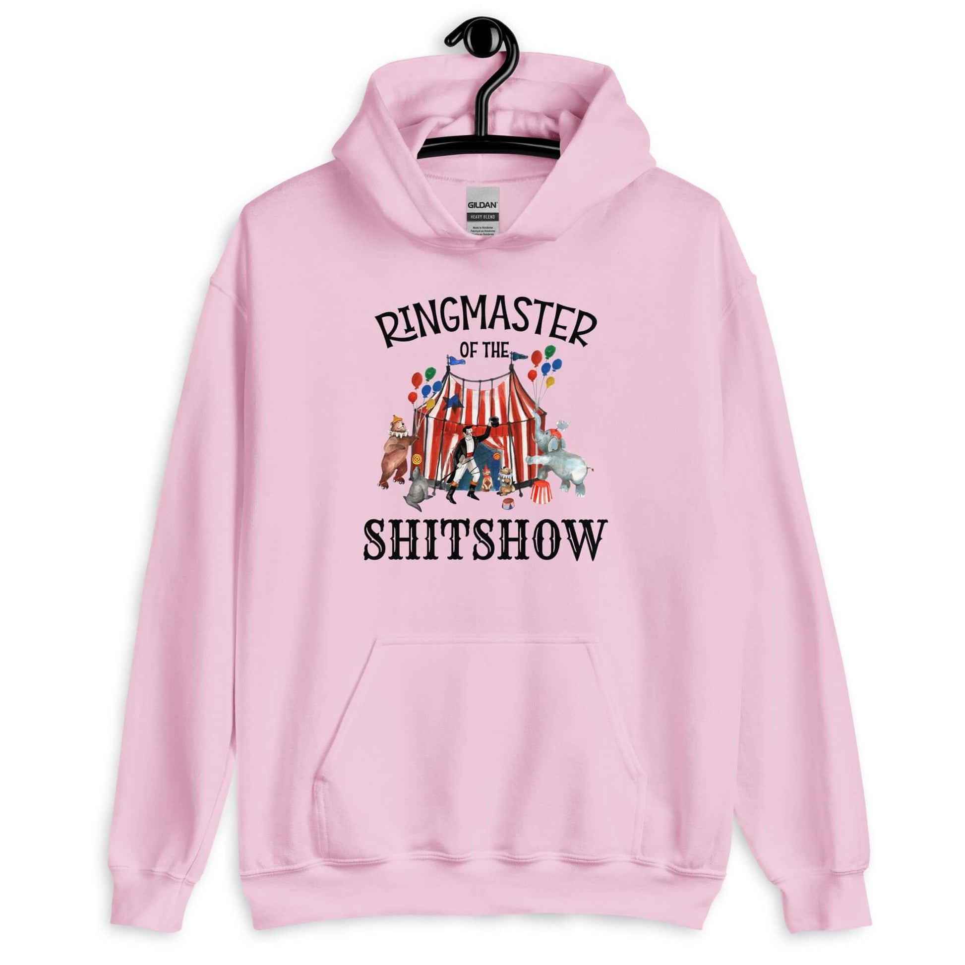 Light pink hoodie sweatshirt with a circus theme graphic and the words Ringmaster of the Shitshow printed on the front.