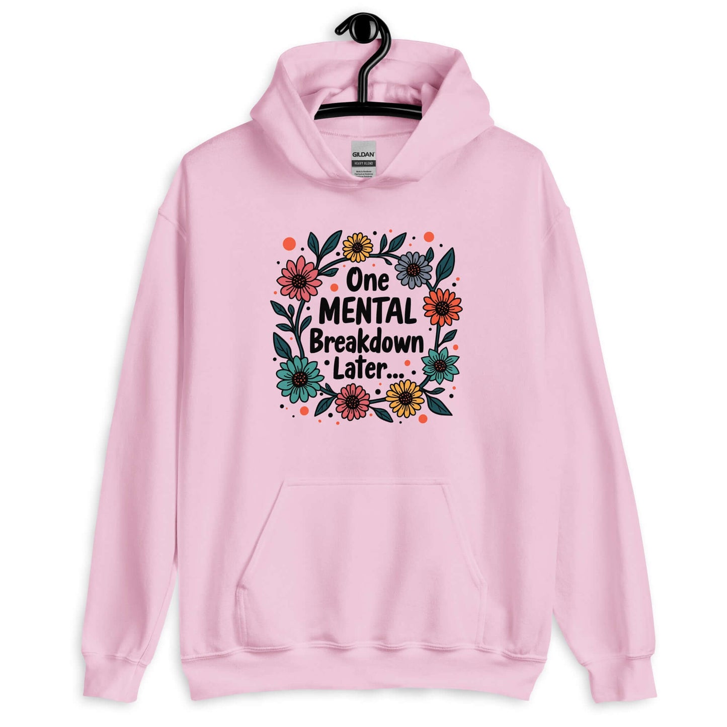 Light pink hoodie sweatshirt with a multi color floral wreath design printed on the front. The words One mental breakdown later are printed in the center of the wreath.