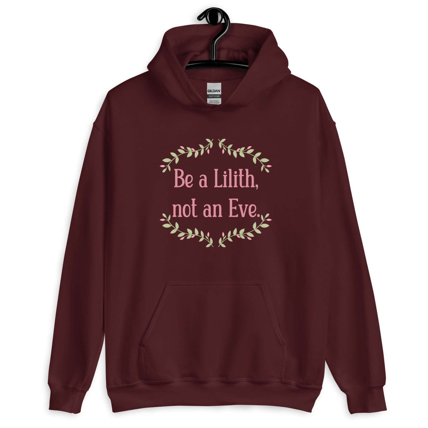 Maroon hoodie sweatshirt with the phrase Be a Lilith, not an Eve printed on the front. The text is pink and had a green floral vine graphic framing the text.