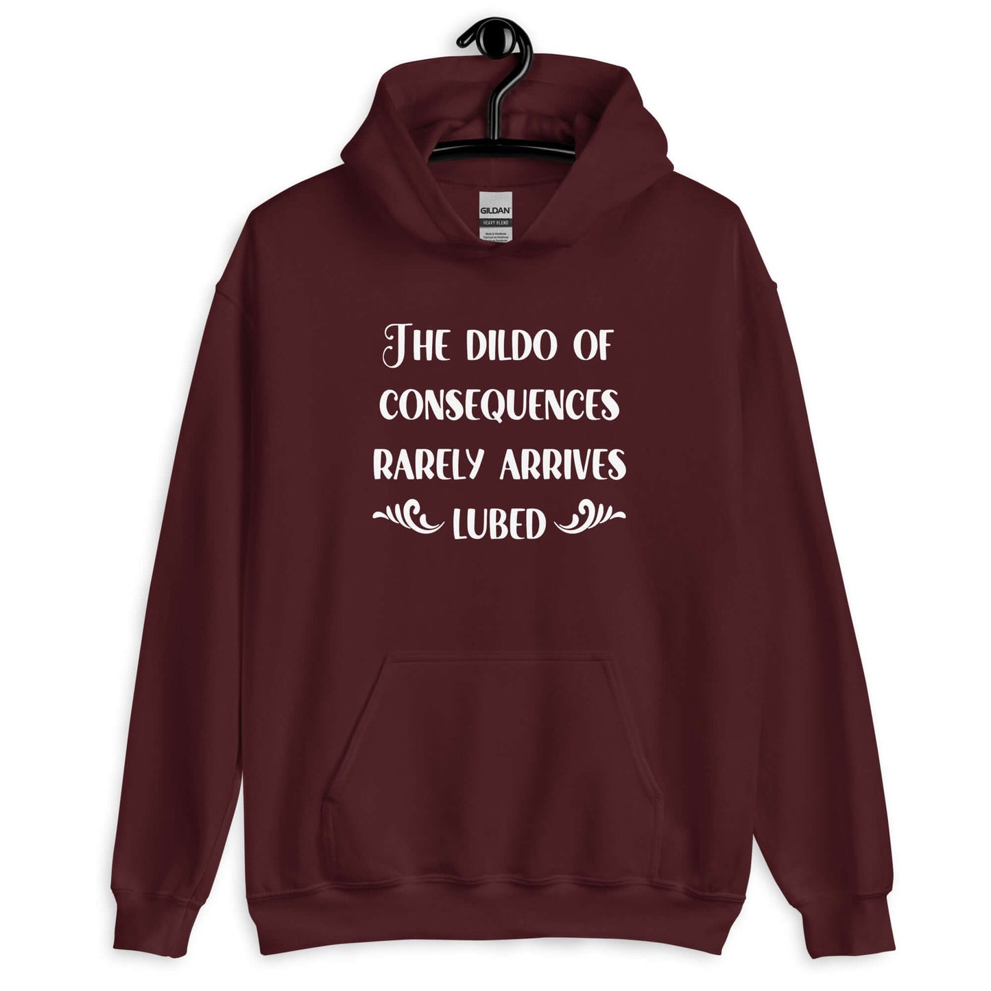 Maroon hoodie sweatshirt with the phrase The dildo of consequences rarely arrives lubed printed on the front.