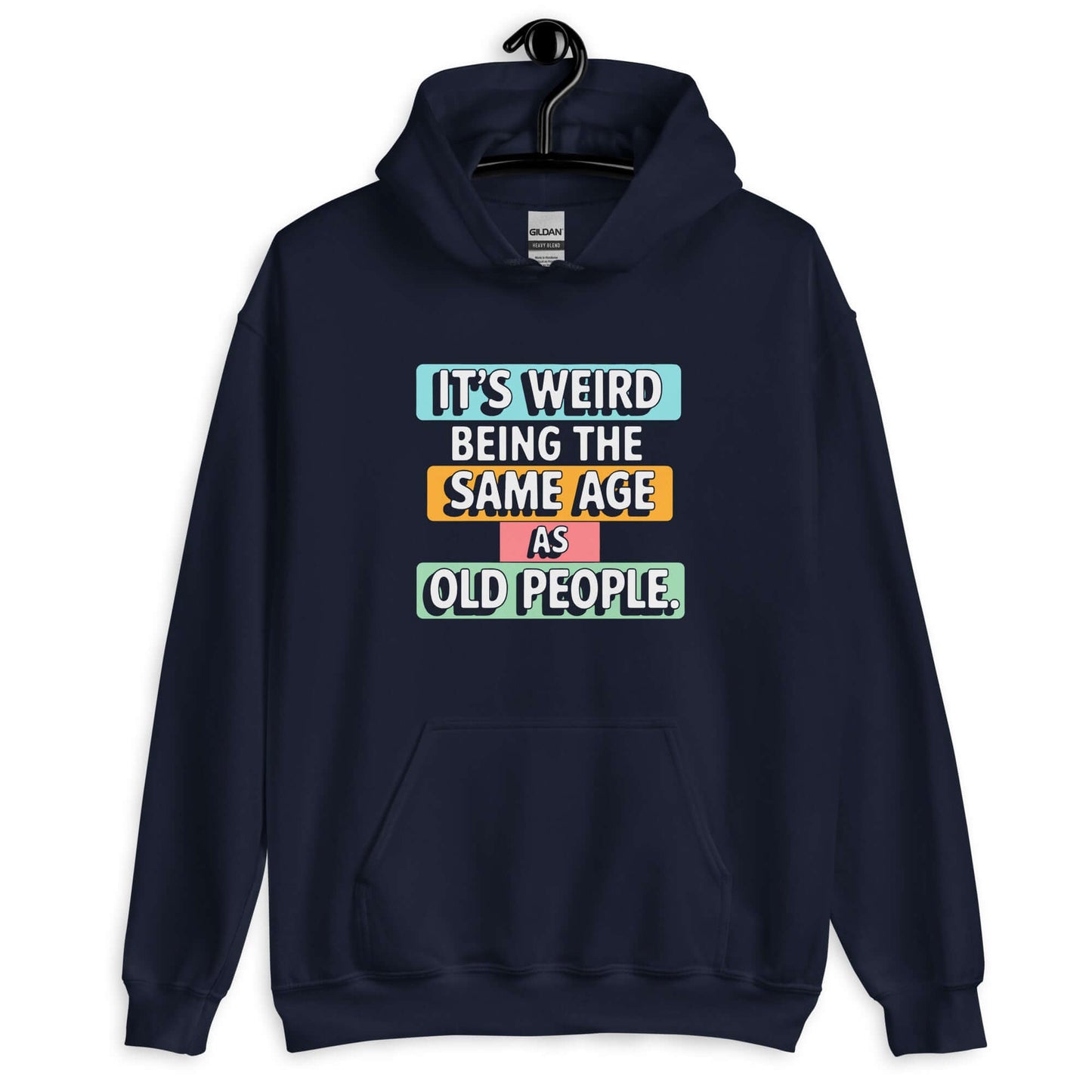 Navy blue hoodie sweatshirt with colorful graphics that say It's weird being the same age as old people printed on the front.