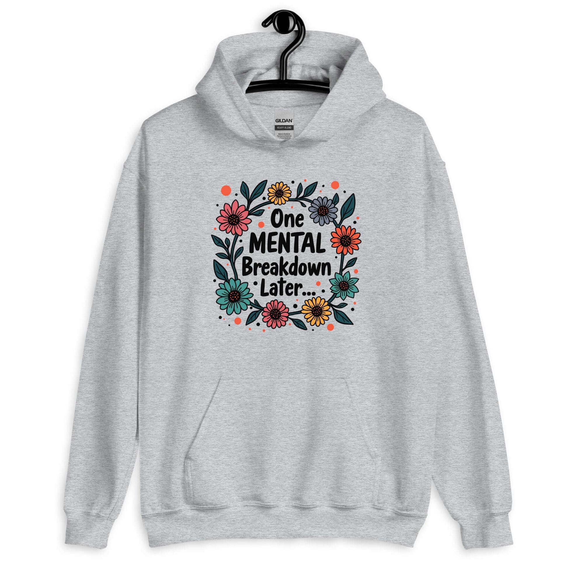 Sport grey hoodie sweatshirt with a multi color floral wreath design printed on the front. The words One mental breakdown later are printed in the center of the wreath.