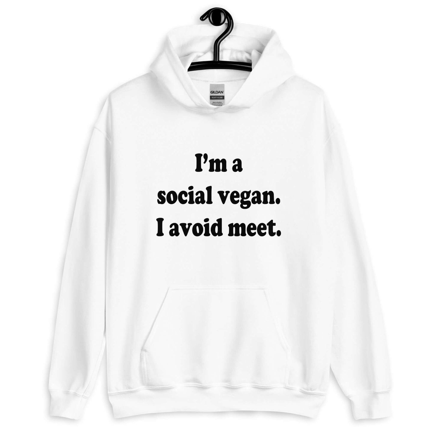 White hoodie sweatshirt with the pun phrase I'm a social vegan, I avoid meet printed on the front.