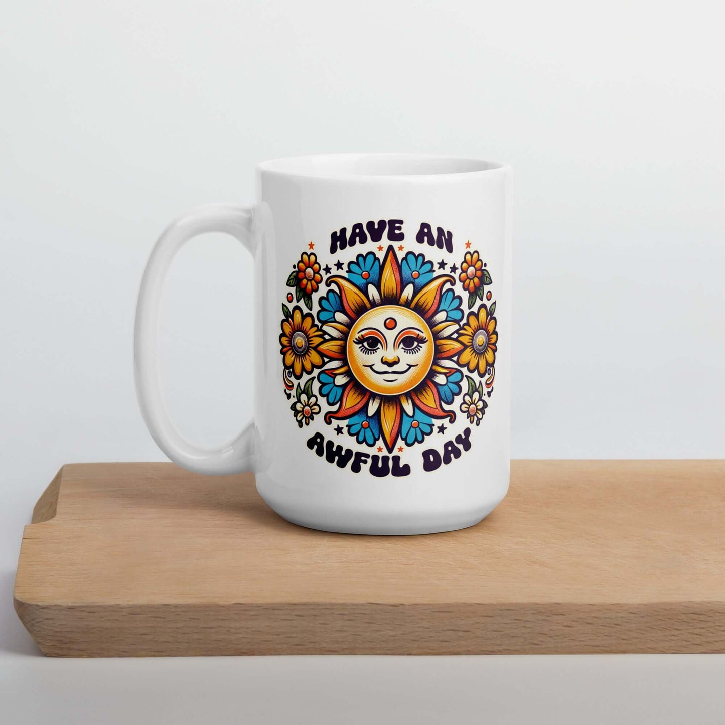 White ceramic coffee mug with a sun graphic and the phrase Have an awful day printed on both sides of the mug.