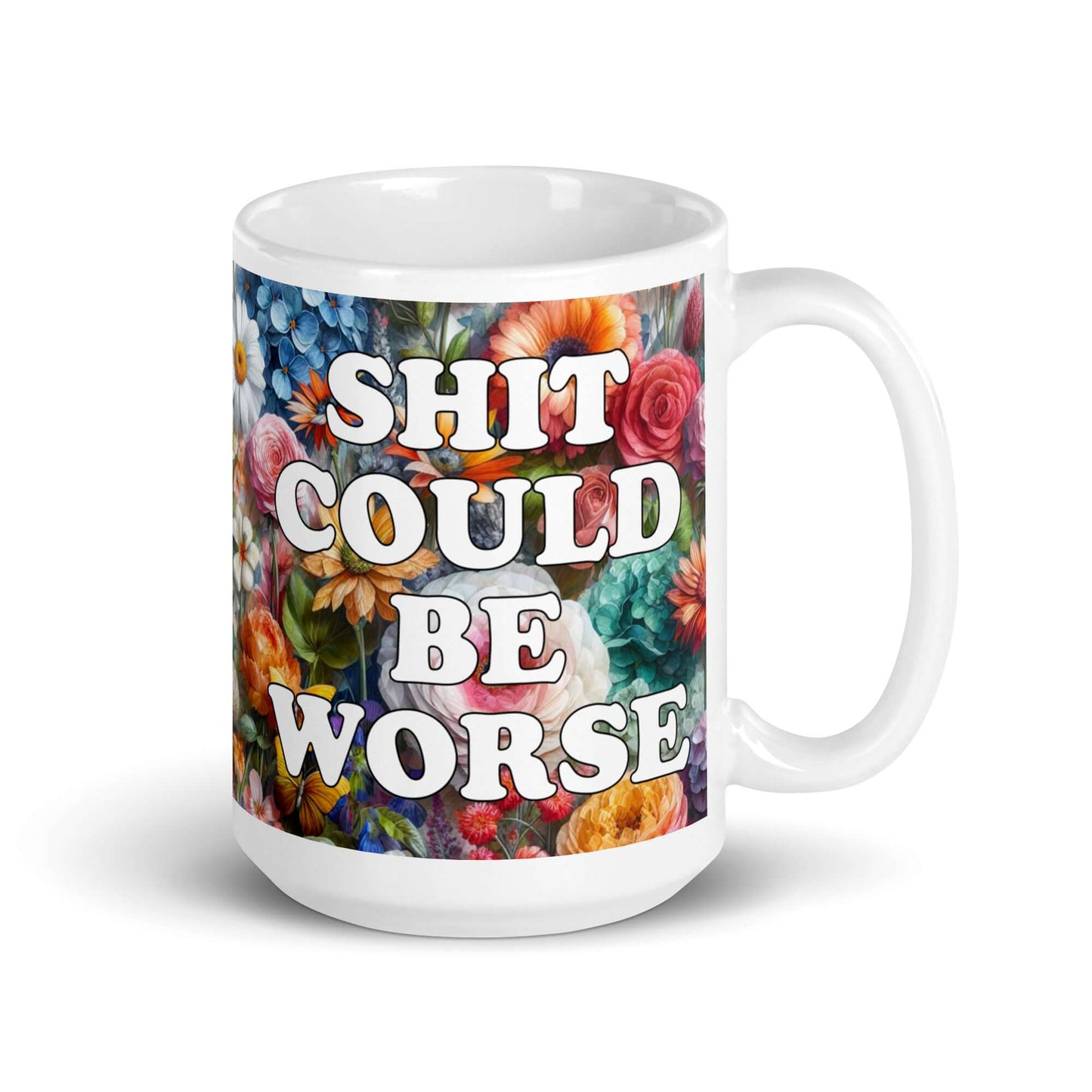 White ceramic mug floral background and the words Shit could be worse printed on both sides.
