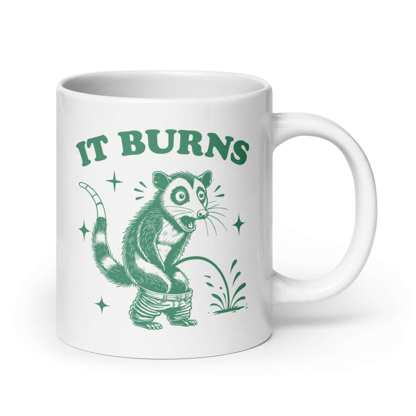 White ceramic mug with an image of an opossum peeing. The words It burns are printed above.