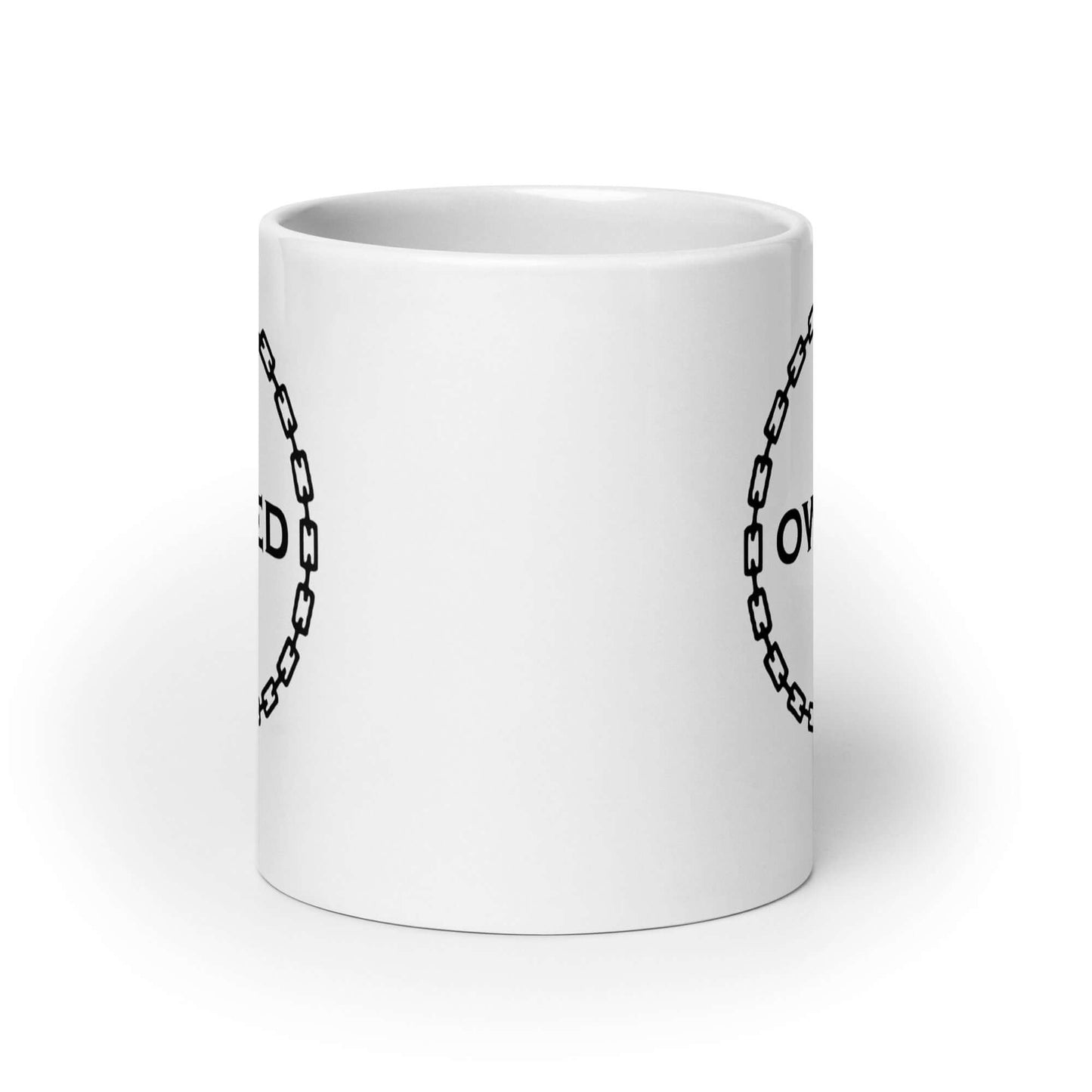 White ceramic coffee mug with an image of a BDSM chain collar with a lock and the word Owned printed in the center of the collar. The design is printed on both sides of the mug.