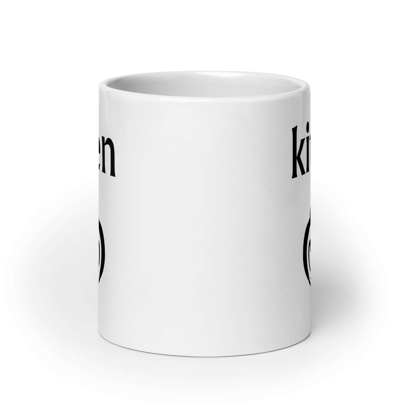 White ceramic coffee mug with an image of a heart shaped lock and the word kitten printed on both sides of the mug.