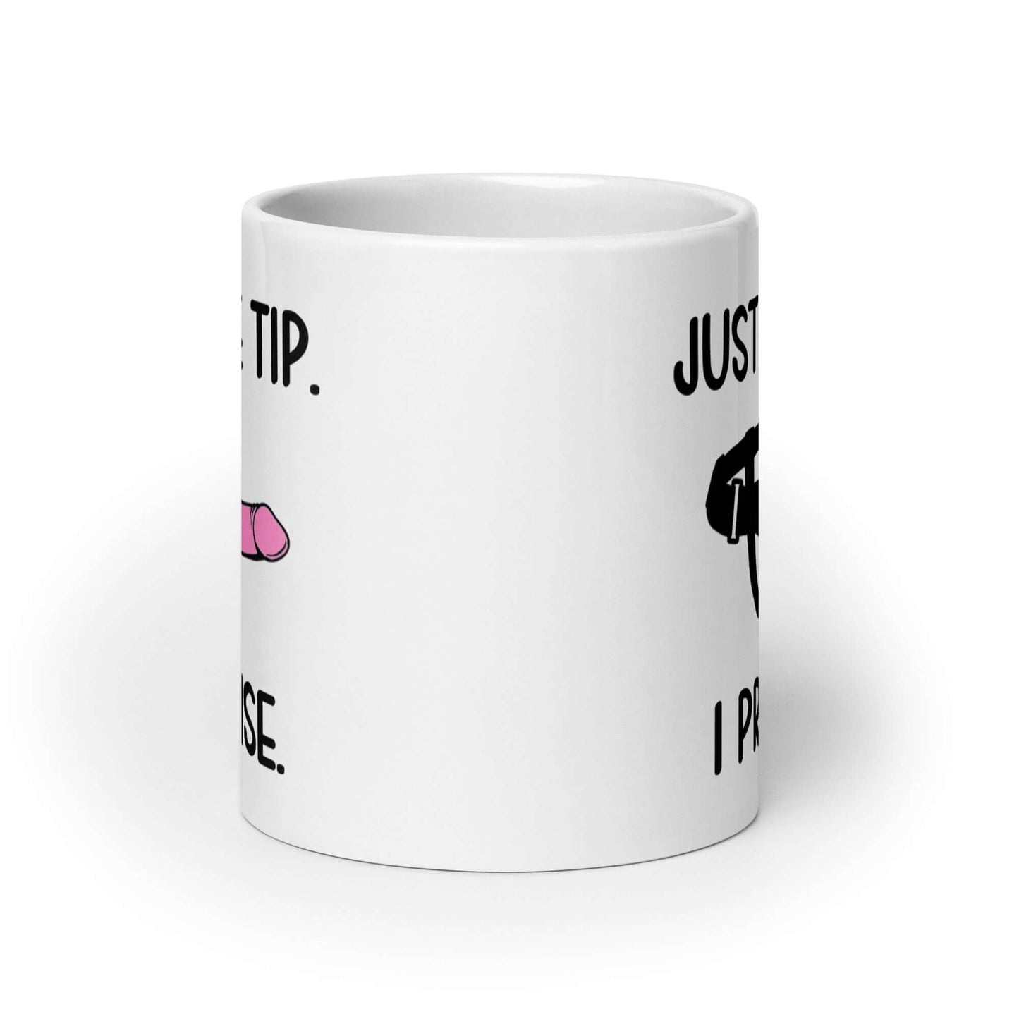 White ceramic coffee mug that has an image of a strap-on dildo and the words Just the tip, I promise printed on both sides. The graphics are pink, black and white.