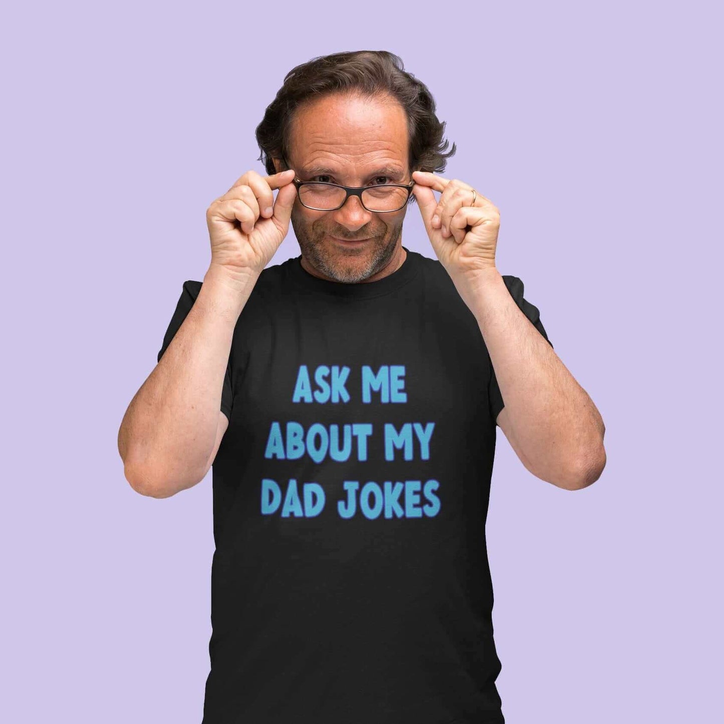 Man wearing black t-shirt with the words Ask me about my Dad jokes printed on the front.
