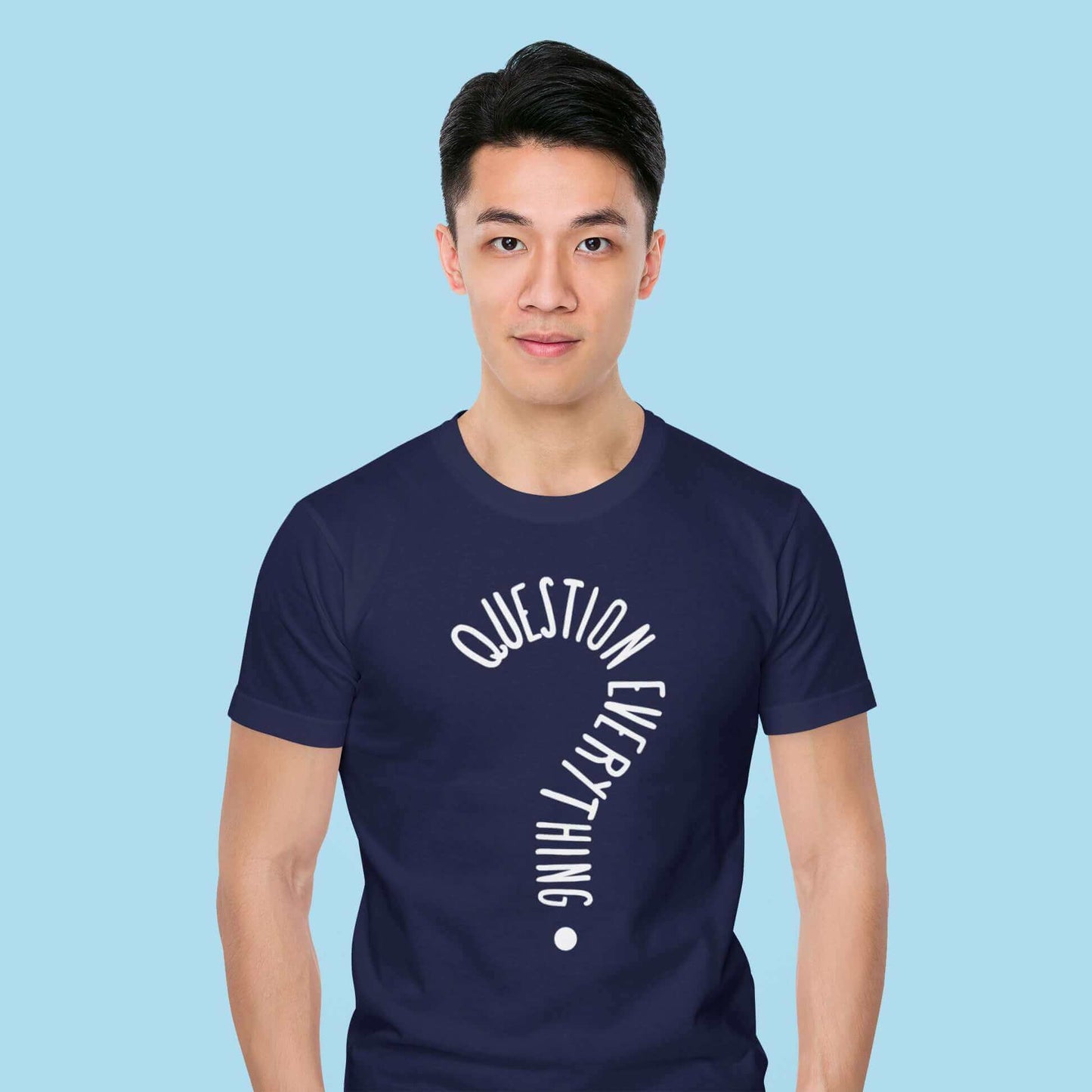 Man wearing a navy blue t-shirt with the words Question everything printed on the front. The words are in the shape of a question mark.